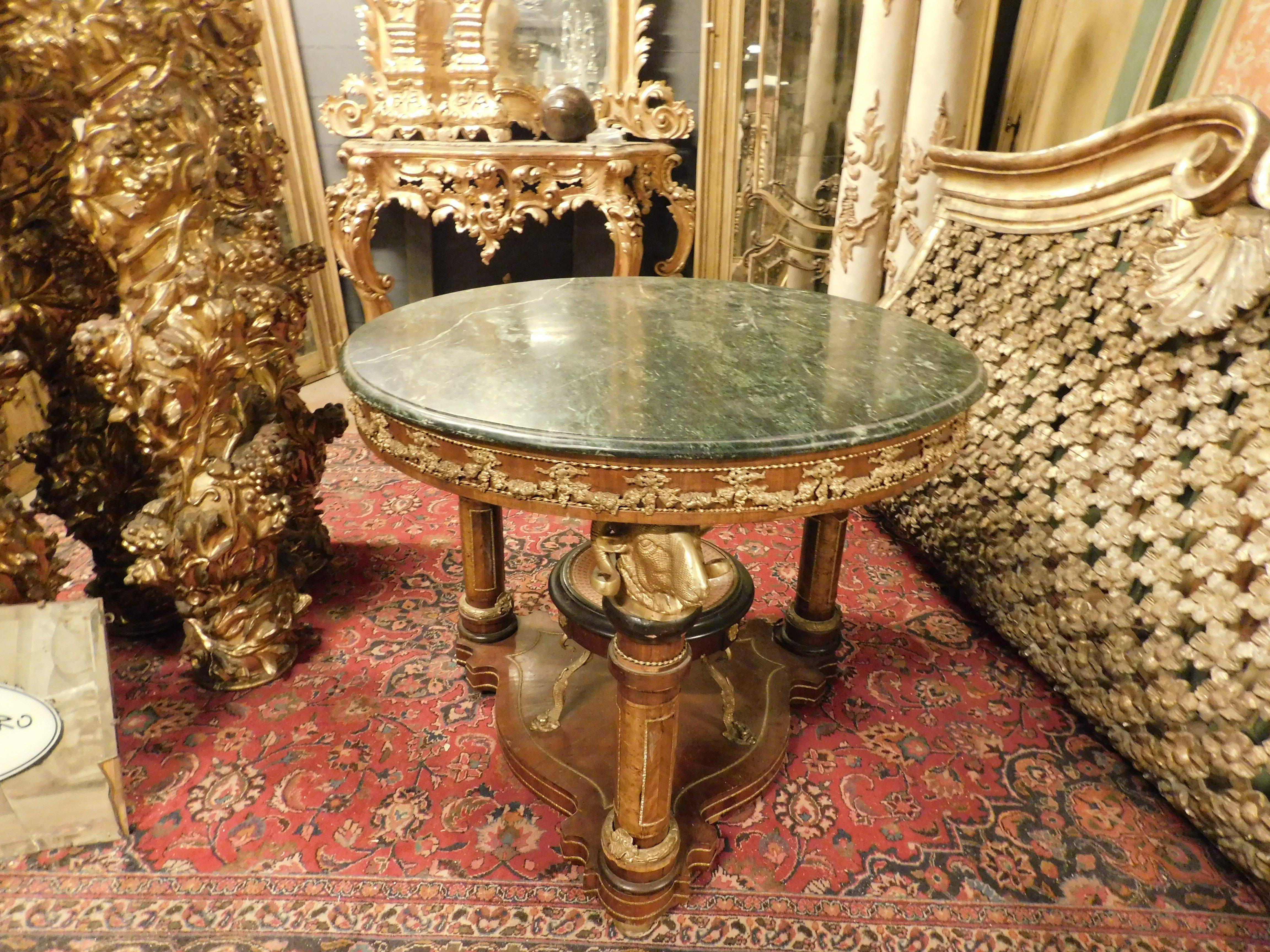 incredible antique round center table, unique in the world, built with a pedestal on the base carrying a precious decorated porcelain plate, on the sides 3 ram's heads in precious chiseled bronzes, upper surface in green Alpine marble, all built in