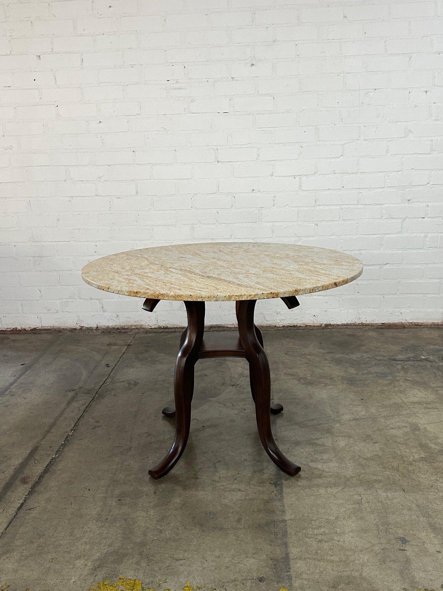 W42 H30.5 Knee Clearance: 29

Small Table with a round granite top and a solid wood sculpted base refinished in a deep walnut stain. Item is structurally sound and sturdy. Top has no visual chips, breaks or stains.
