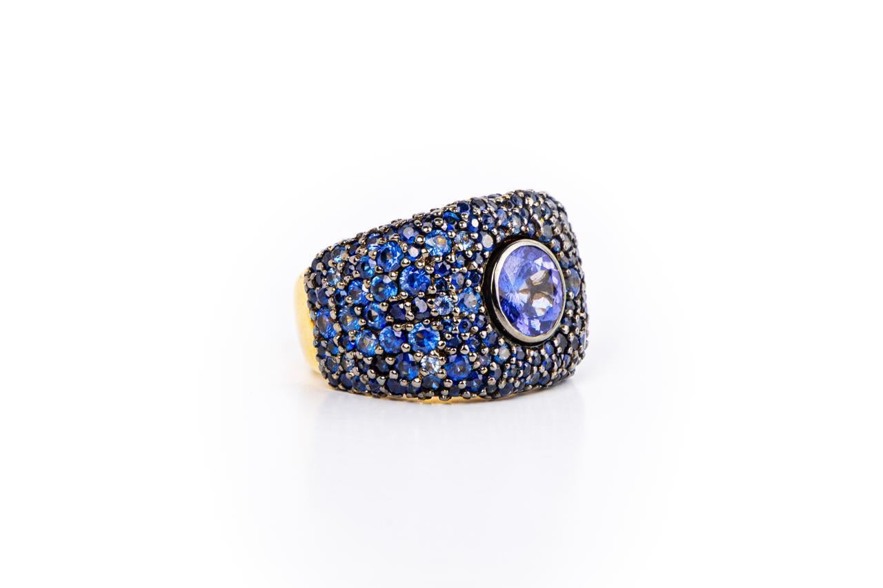 Round Tanzanite And Blue Sapphire Pave Bombe Ring / 18k Yellow And Black Rhodium Gold

Tanzanite 1.76 
Blue Saphire
