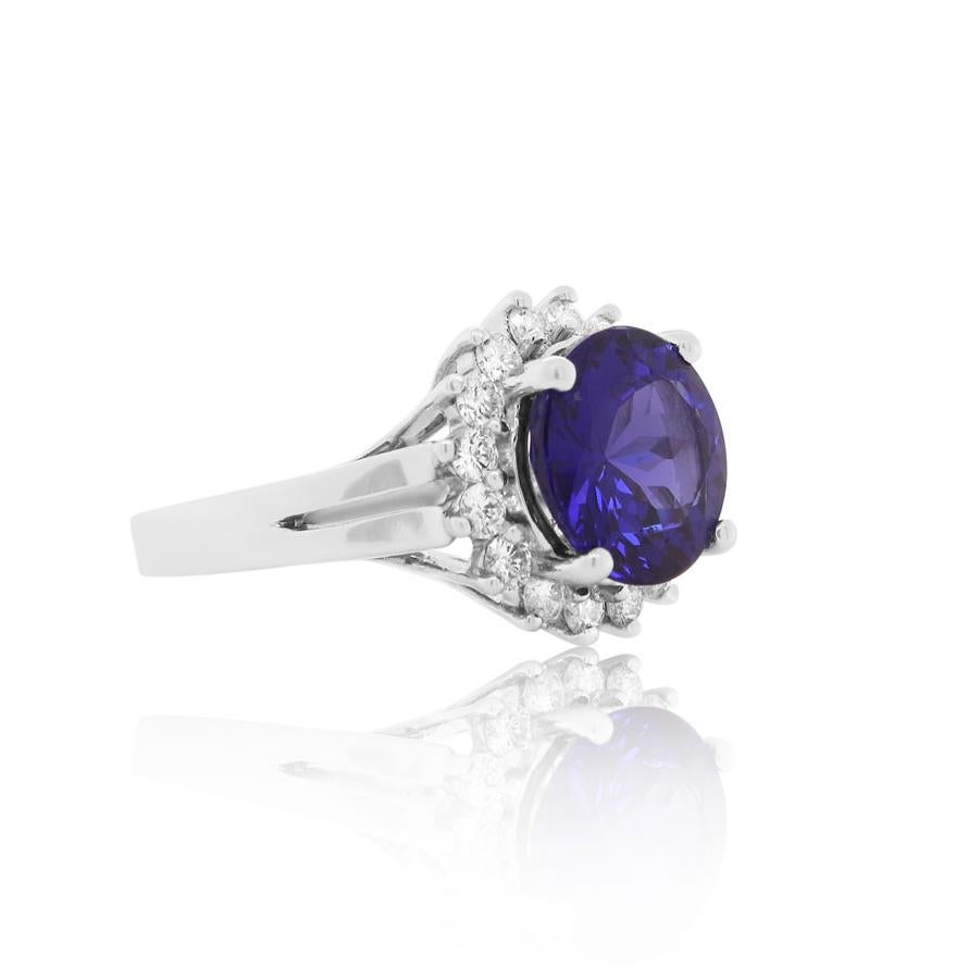 Material: 14K White Gold
Center Stone Details: 1 Round Tanzanite at 3.87 Carats - Measuring 10 millimeters
Side Stone Details: 16 Round Brilliant White Diamonds at 0.60 Carats Total Weight

Fine one-of-a-kind craftsmanship meets incredible quality