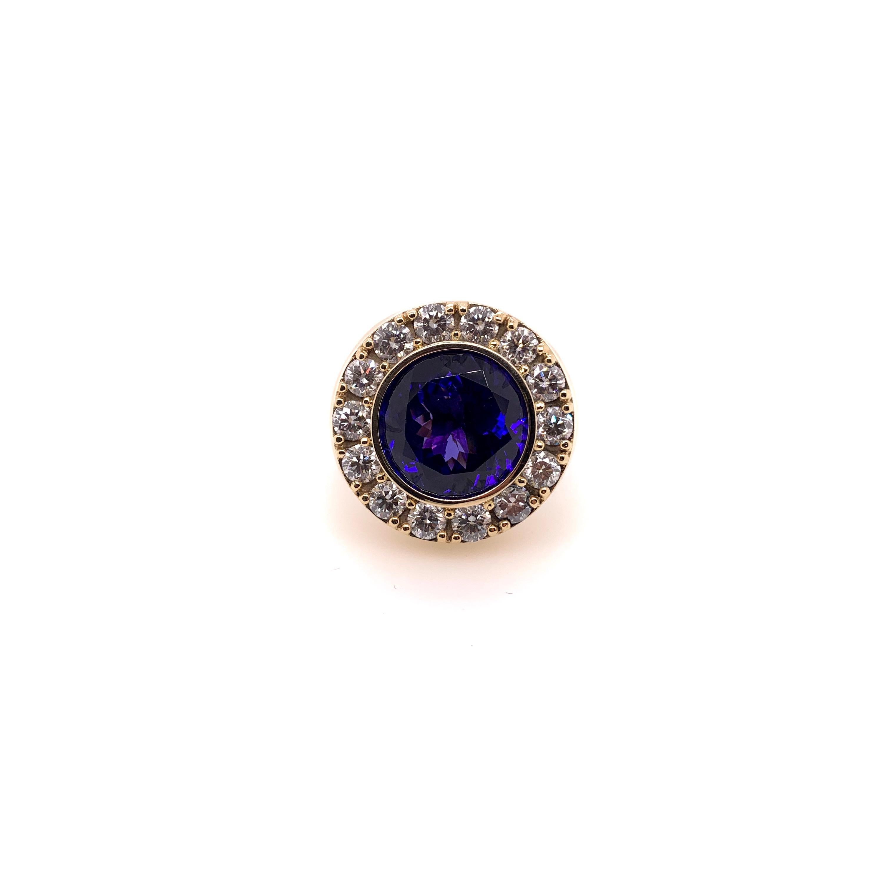 This bold, signet style tanzanite ring is for the individual who wants something different.  The enormous size tanzanite is surrounded by generous size round brilliant cut diamonds.  The setting is a solid, heavy 14k yellow gold with a nice profile