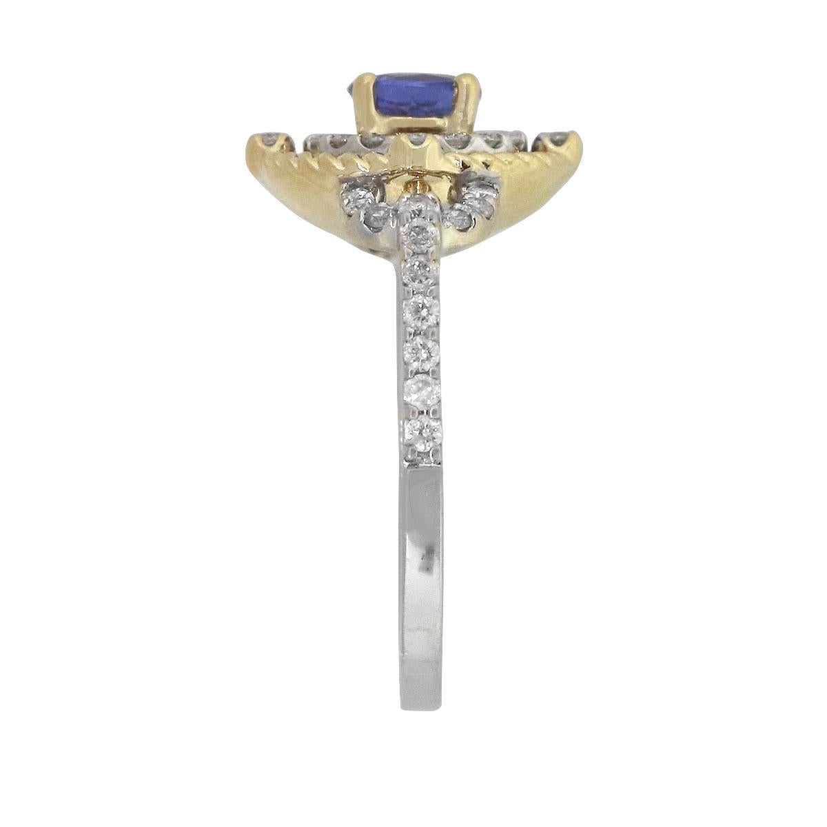 Material: 14k yellow and white gold
Center Gemstone Details: Approx. 0.50ct round cut tanzanite stone.
Adjacent Diamond Details: Approx. 0.69ctw of round cut diamonds. Diamonds are G/H in color and VS in clarity
Ring Measurements: 0.80″ x 0.53″ x