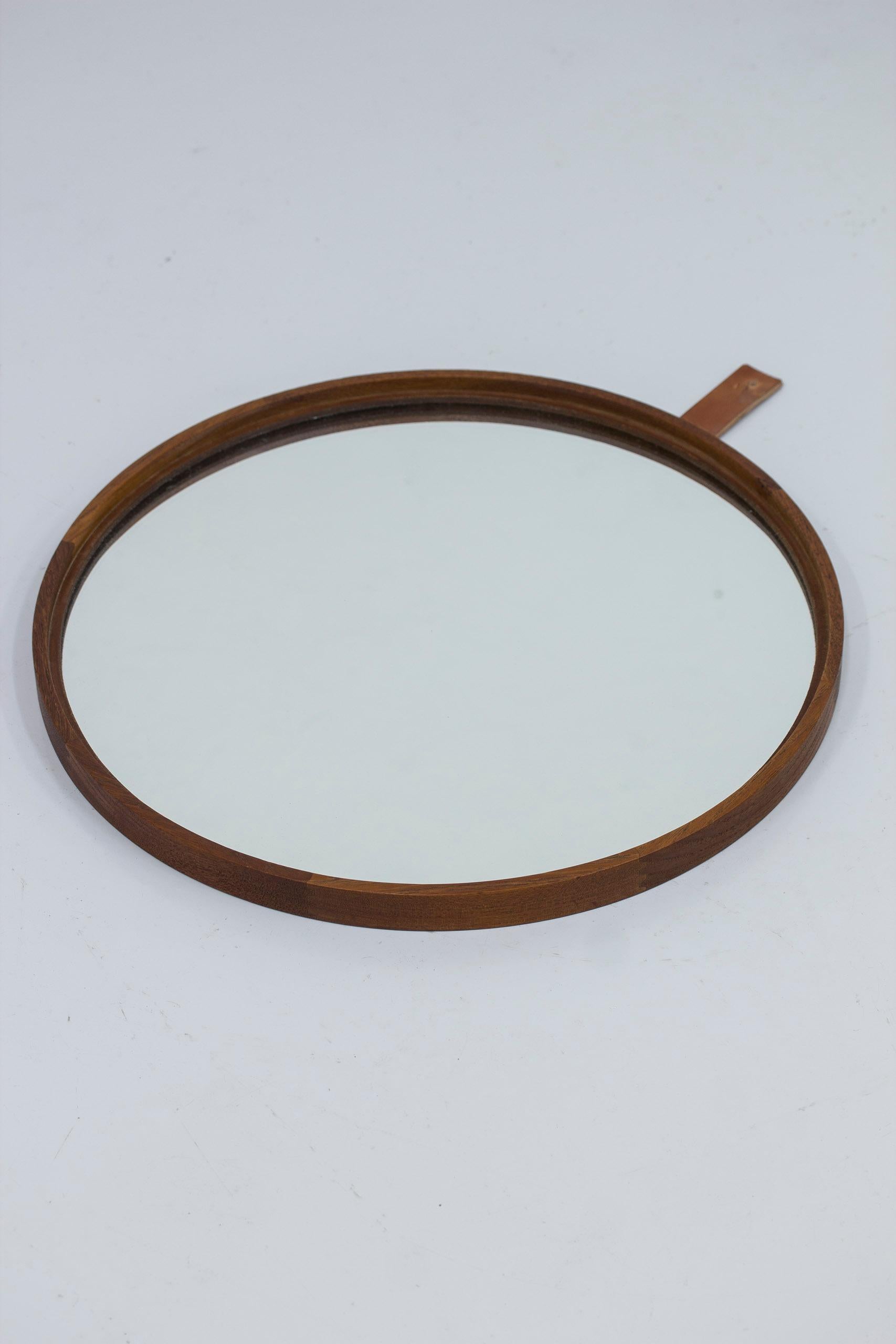 Swedish Round teak and leather wall mirror by Uno & Östen Kristiansson. For Sale