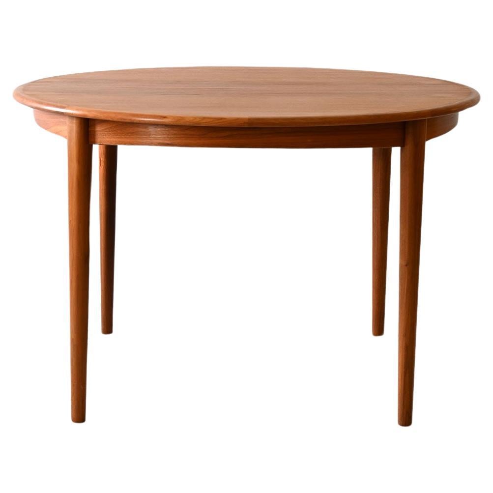 Round teak dining table