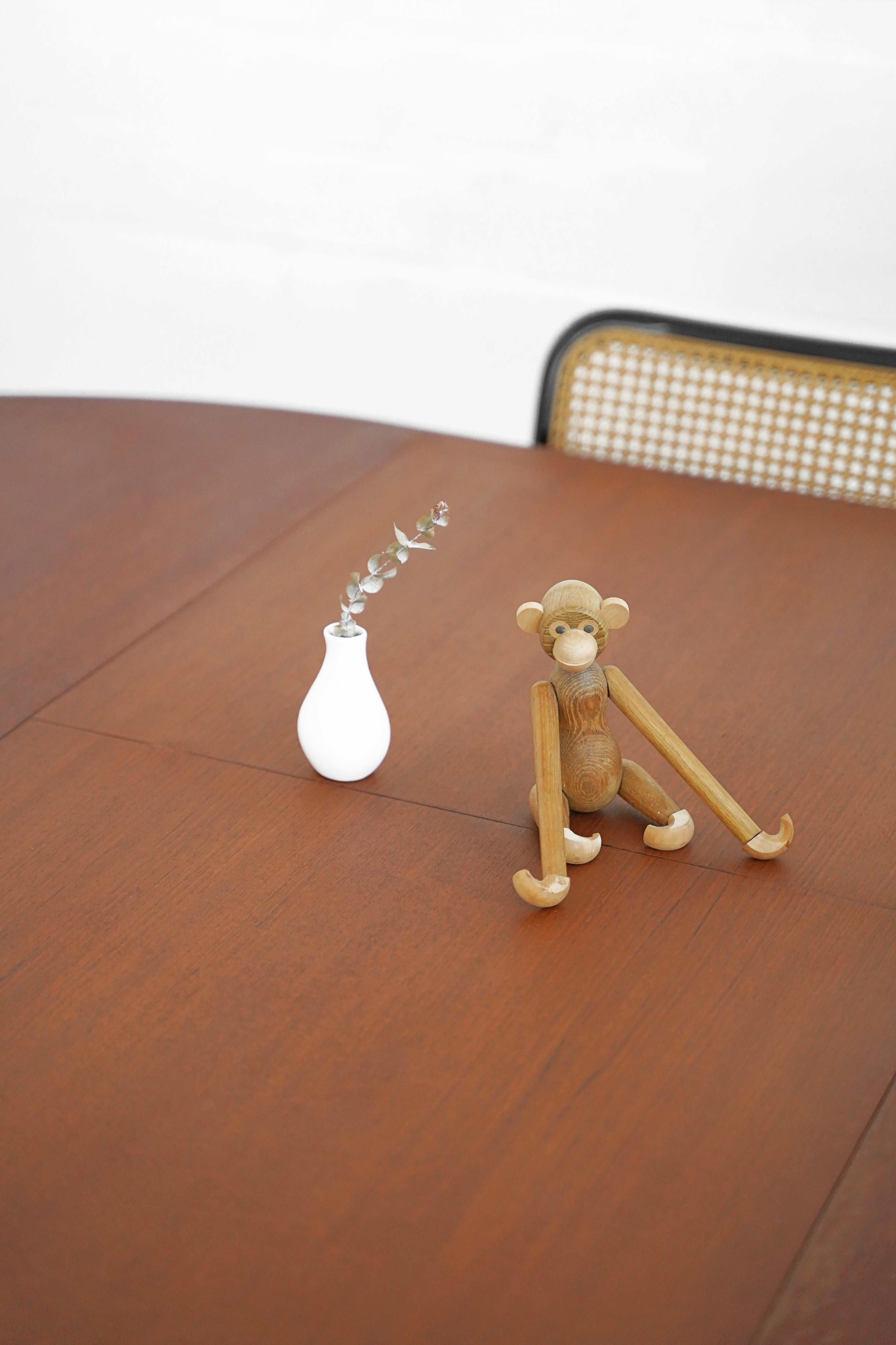 Danish teak dining table with stored butterfly leaf by N & R Mobler. In overall good vintage condition, a stunning piece for any home.