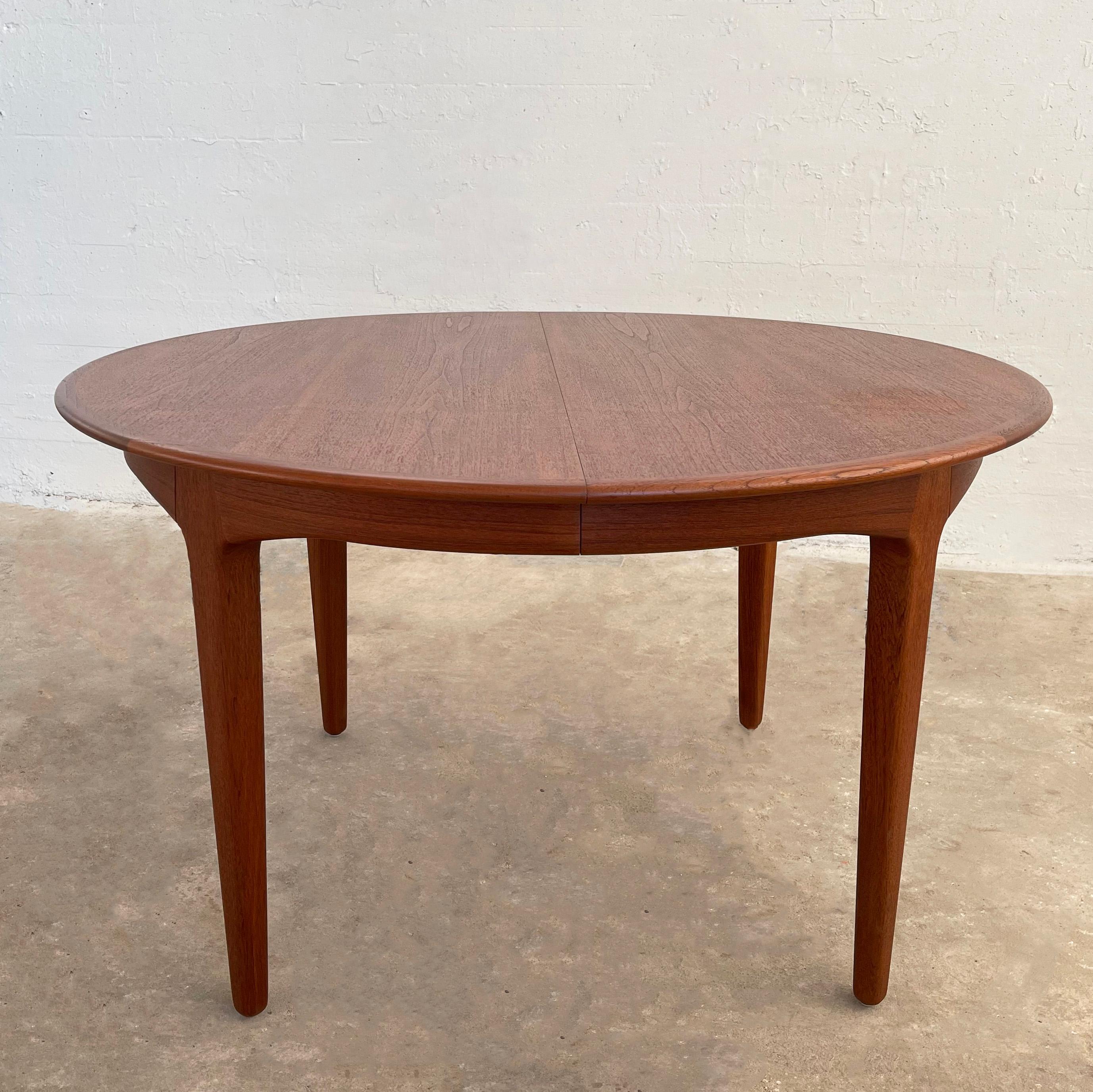Danish modern, round, teak dining table by Danish architect Henning Kjaernulf for Soro Stole expands from 49 - 89 inches with two separate 20 inch leaves. The table comfortably seats 4 and expands to accommodate up to 8 guests. It's an elegant