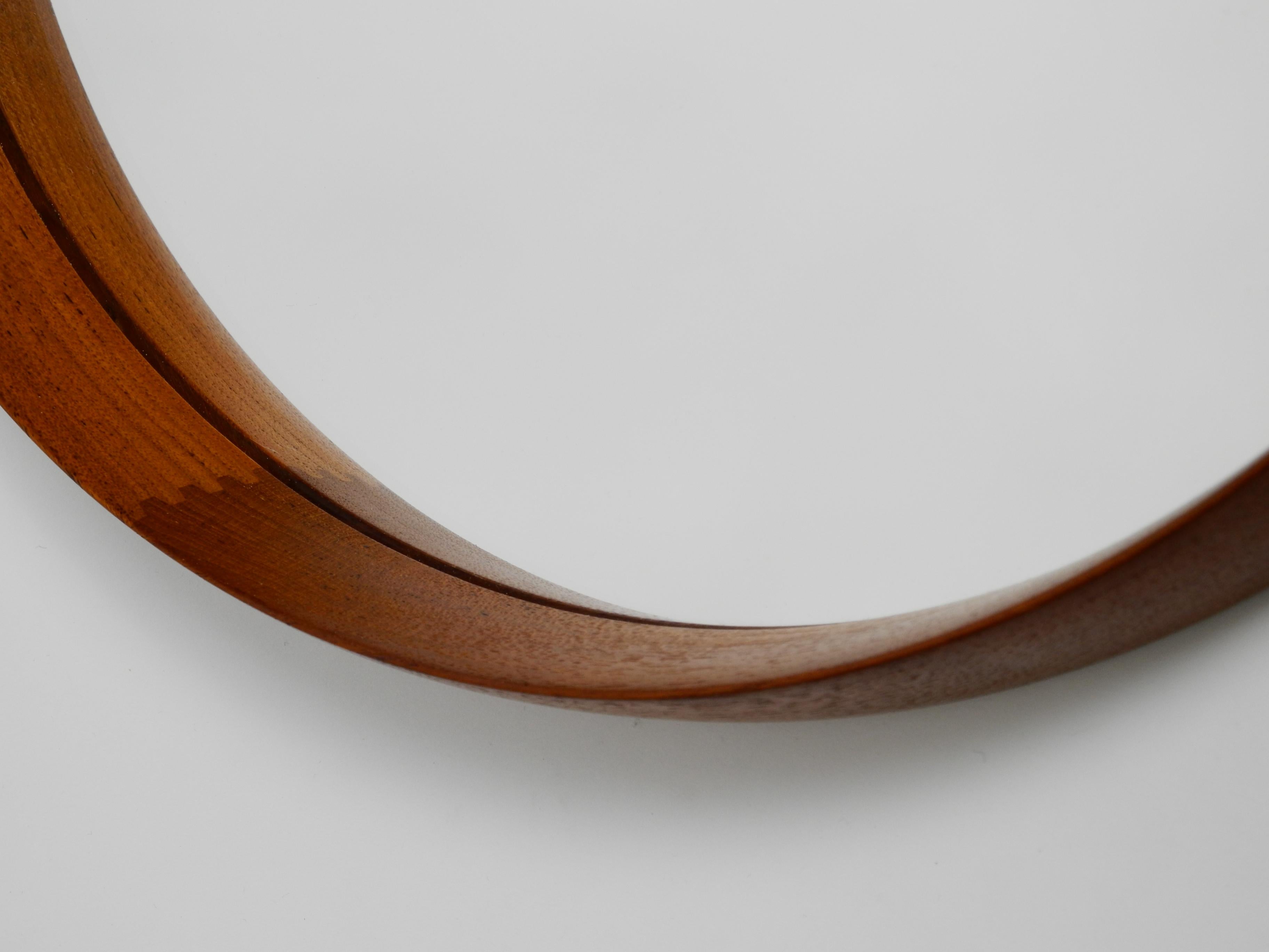 Mid-20th Century Round Teak Mirror with Leather Straps by Uno and Östen Kristiansson for Luxus For Sale