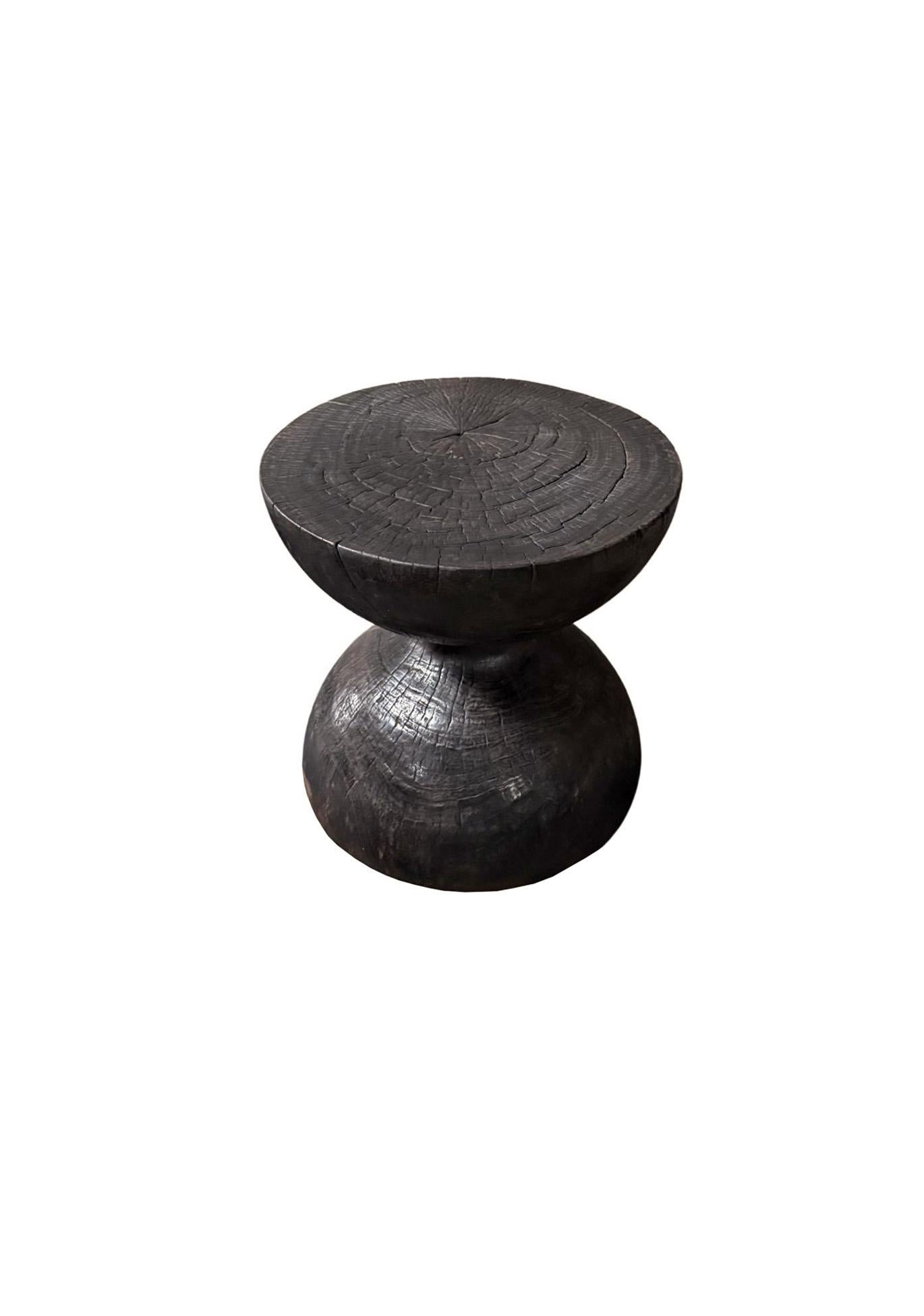 Elevate your space with the natural beauty and timeless elegance of this solid suar wood side table, expertly crafted from a single block of premium-grade suar wood. Showcasing stunning, organic wood contours and rich natural textures, each table is