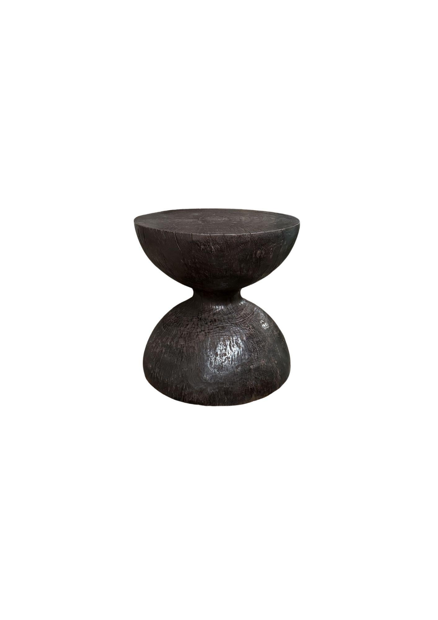 Indonesian Round Suar Wood Side Table, Burnt Finish, Layered Design, Modern Organic For Sale