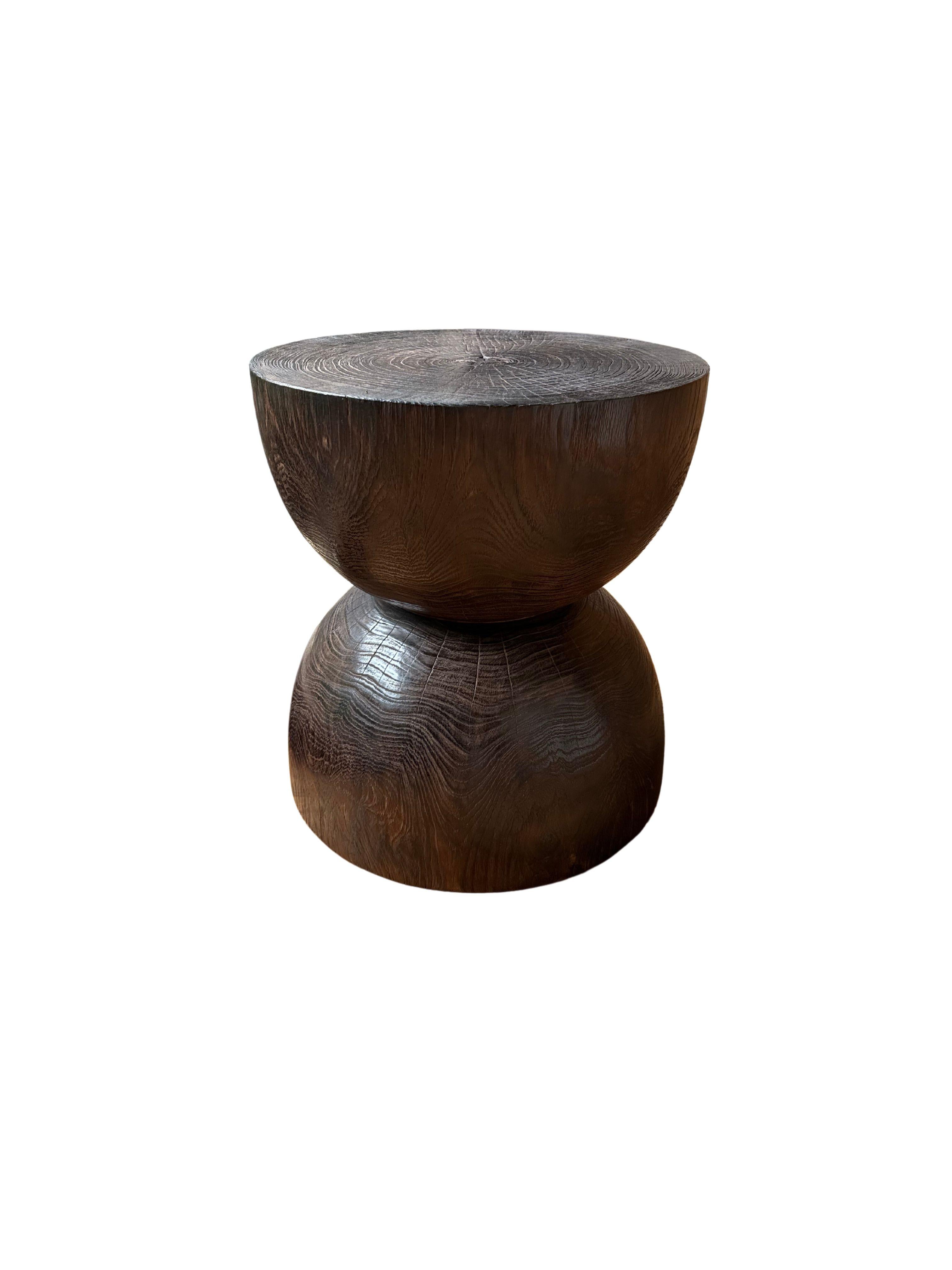 Indonesian Round Teak Wood Side Table, Burnt Finish, Hour Glass Design, Modern Organic For Sale