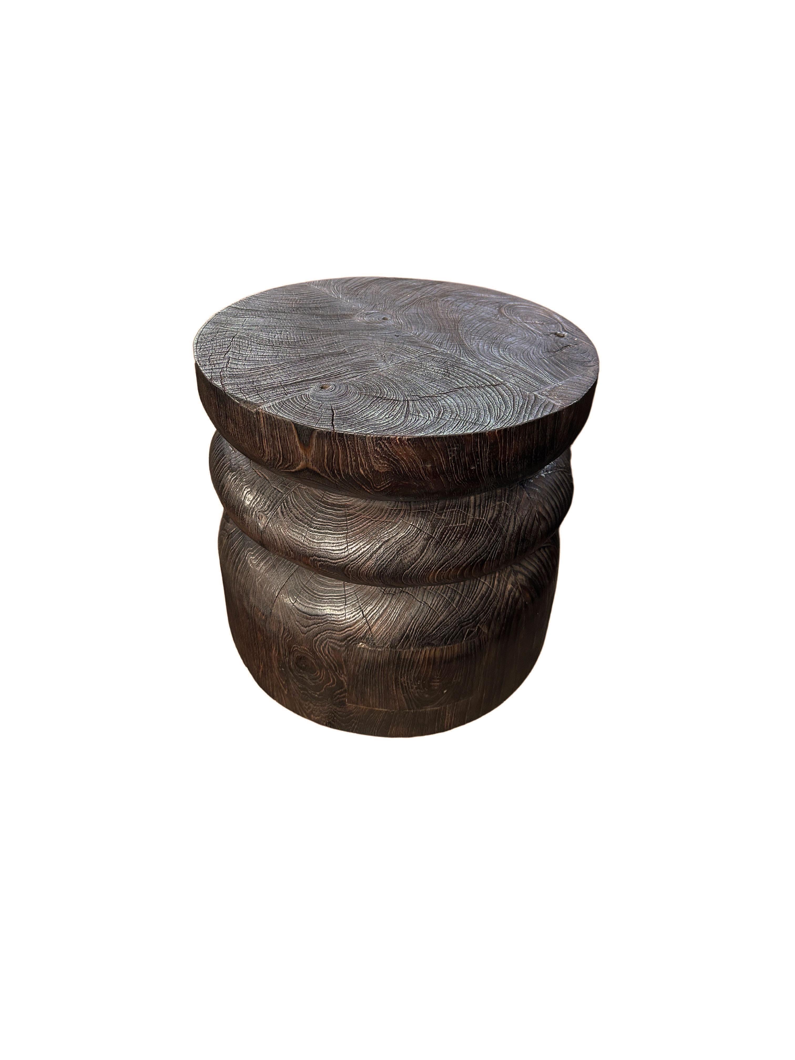 Indonesian Round Teak Wood Side Table, Burnt Finish, Layered Design, Modern Organic For Sale