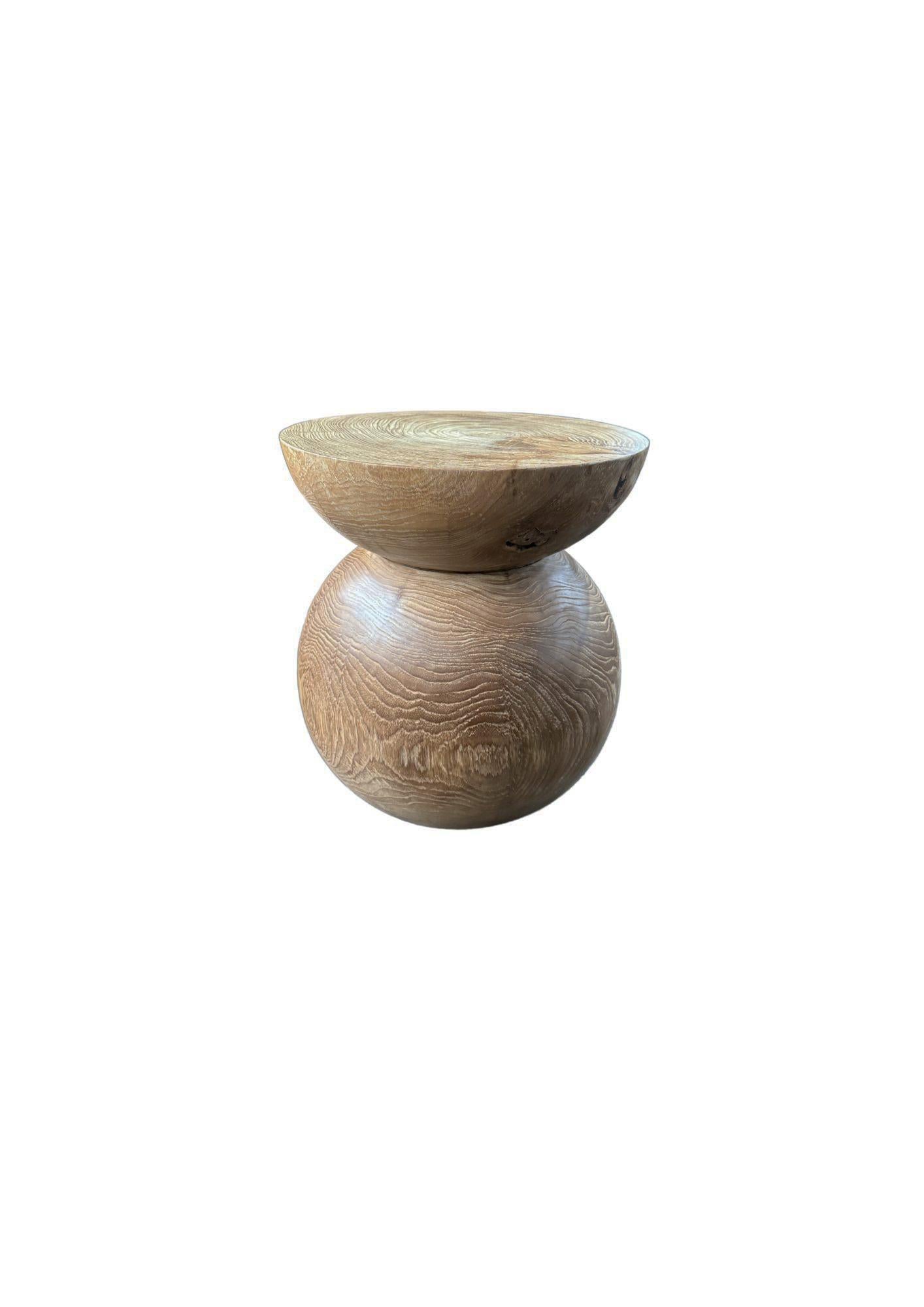 Elevate your space with the natural beauty and timeless elegance of this solid teak wood side table, expertly crafted from a single block of premium-grade teak. Showcasing stunning, organic wood contours and rich natural textures, each table is a