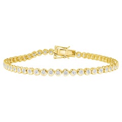 Tennisarmband aus 14 Karat Gold mit strahlendem, rundem Diamanten in Lünettenfassung