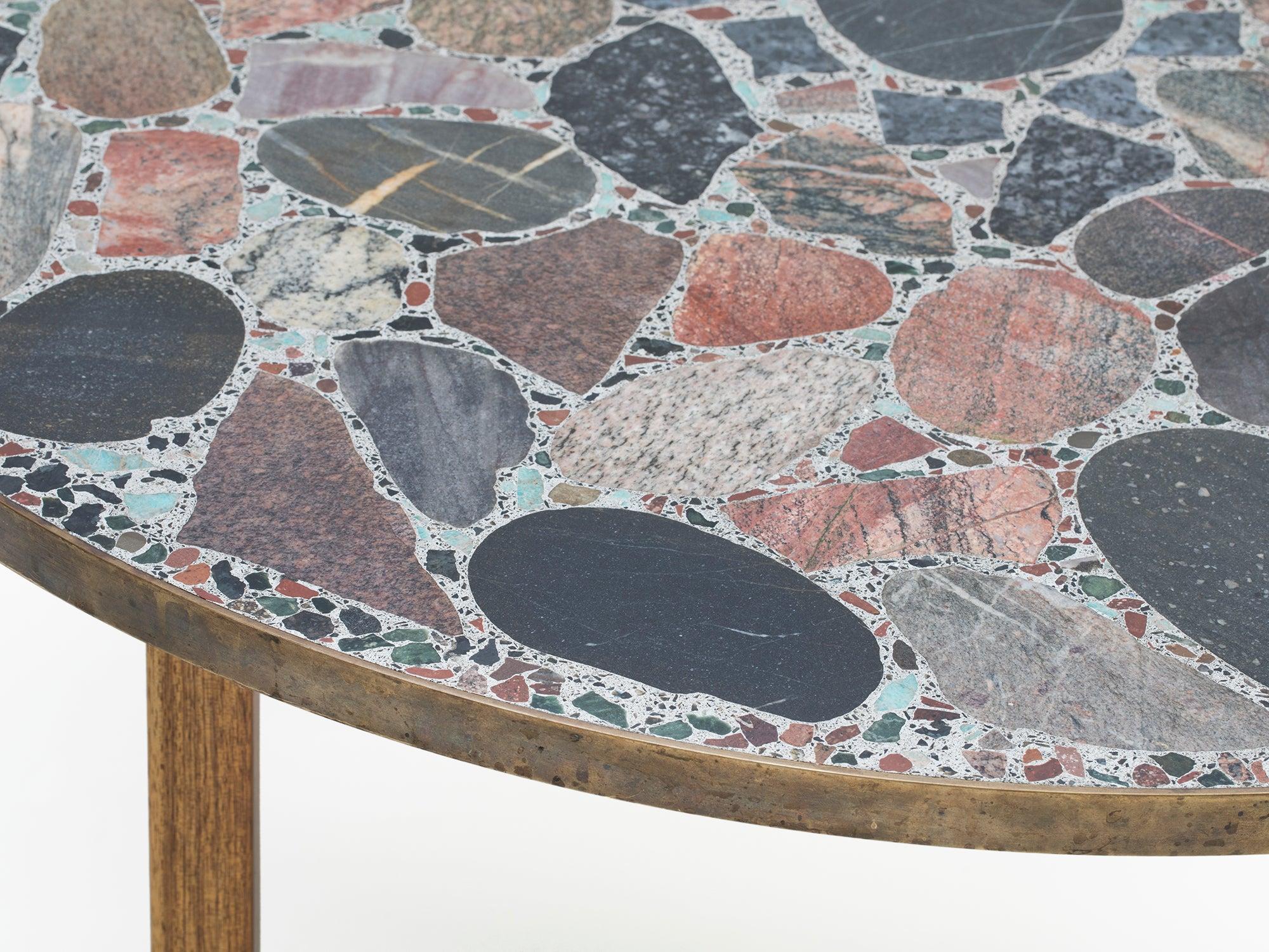 Erling Viksjø was a Norwegian architect and designer best known for his Brutalist architecture and furniture using concrete and stones. This unique circular terrazzo coffee table from the 1960s is made of concrete, Norwegian stones, and