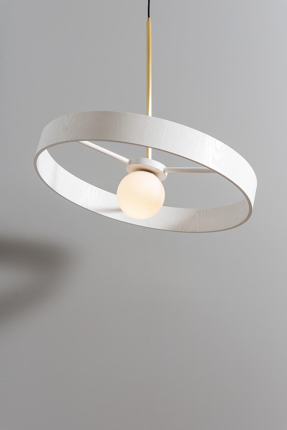 Round thin pendant by ASAF Weinbroom Studio
Dimensions: Ø70 x 57 cm
Materials: Ball glass + Wood + Brass

Canopy: Brass
Cord fabric: Black 2m
Wattage / Type socket: 15w Max Led / E27
ASAF WEINBROOM studio was established in 2009.

All our