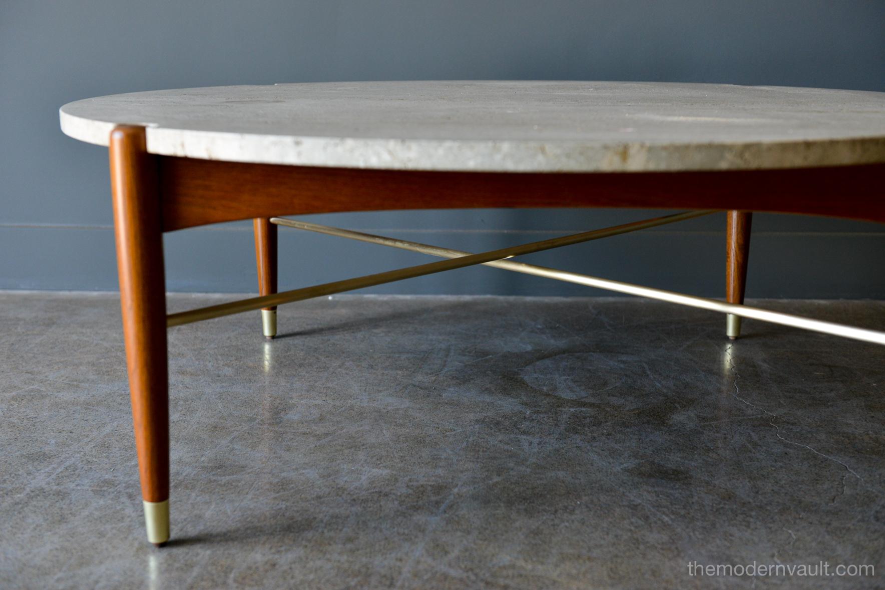 Round travertine and brass coffee table by DUX, circa 1965. Beautiful sculpted teak legs, brass x base stretcher bars and tipped feet. Original heavy travertine with notched edges for the legs. Stamped on underside, often attributed to Bruno