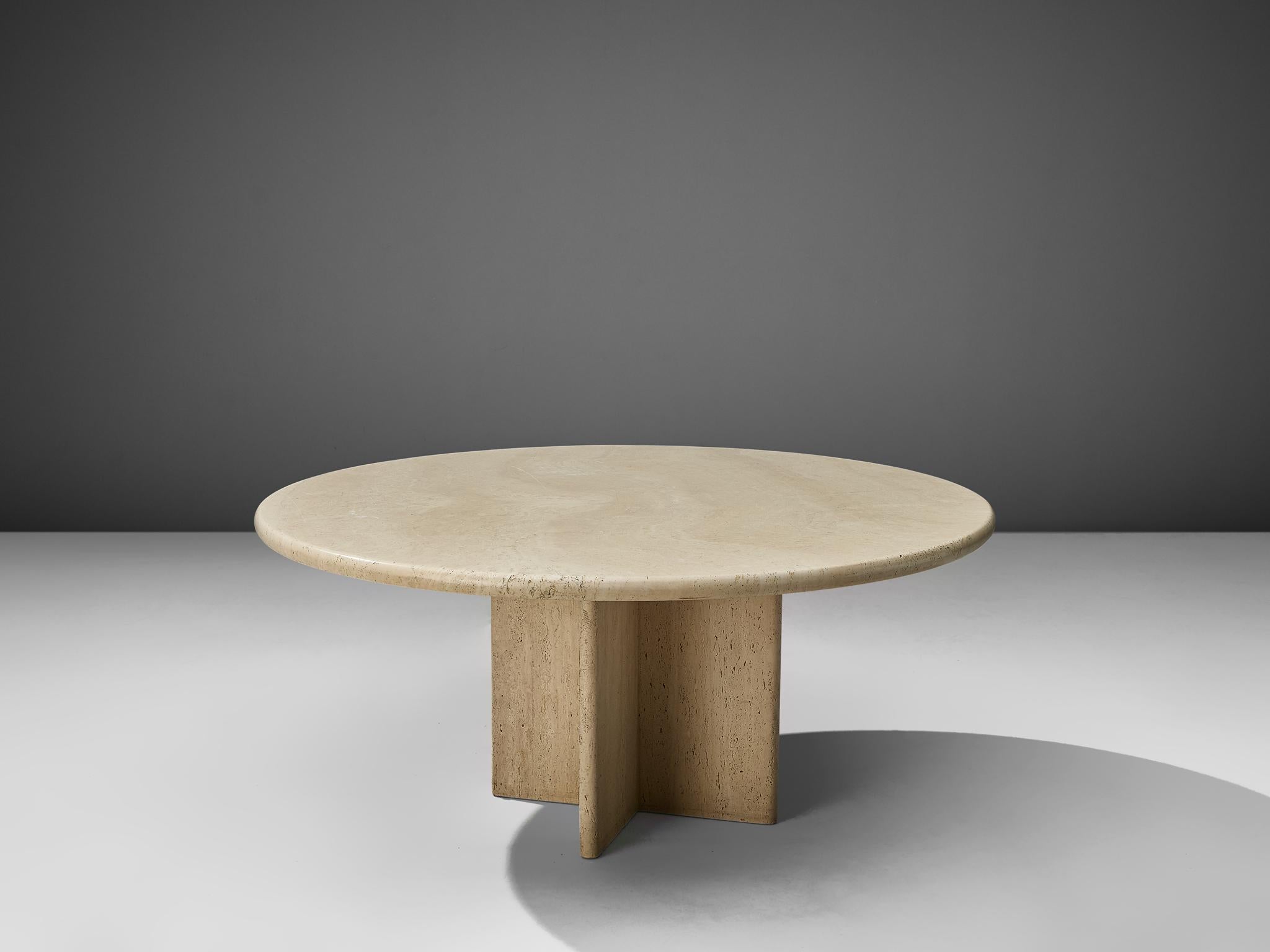Coffee table, travertine, Italy, 1970s.

This coffee table in travertine features a cross shaped base with a round tabletop. The aesthetics are archetypical for postmodern design, bearing references to architectural forms and without a clean