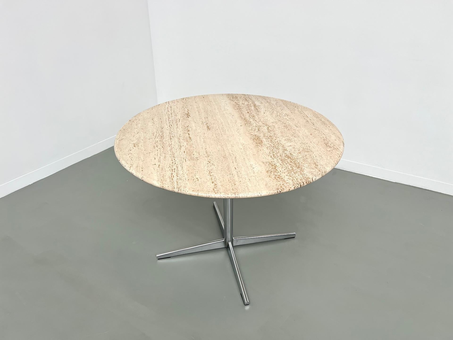 Round travertine dining table, circa 1970. 10