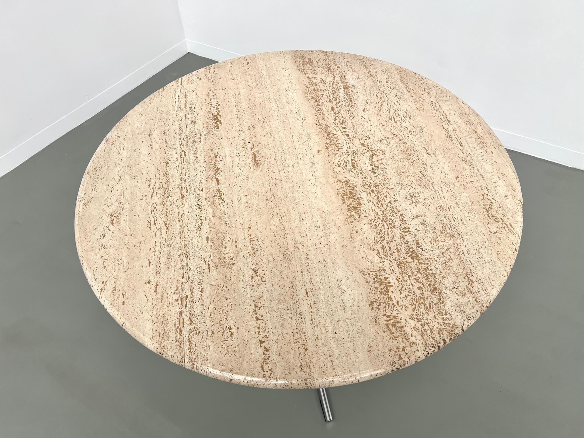 Round travertine dining table, circa 1970. 12