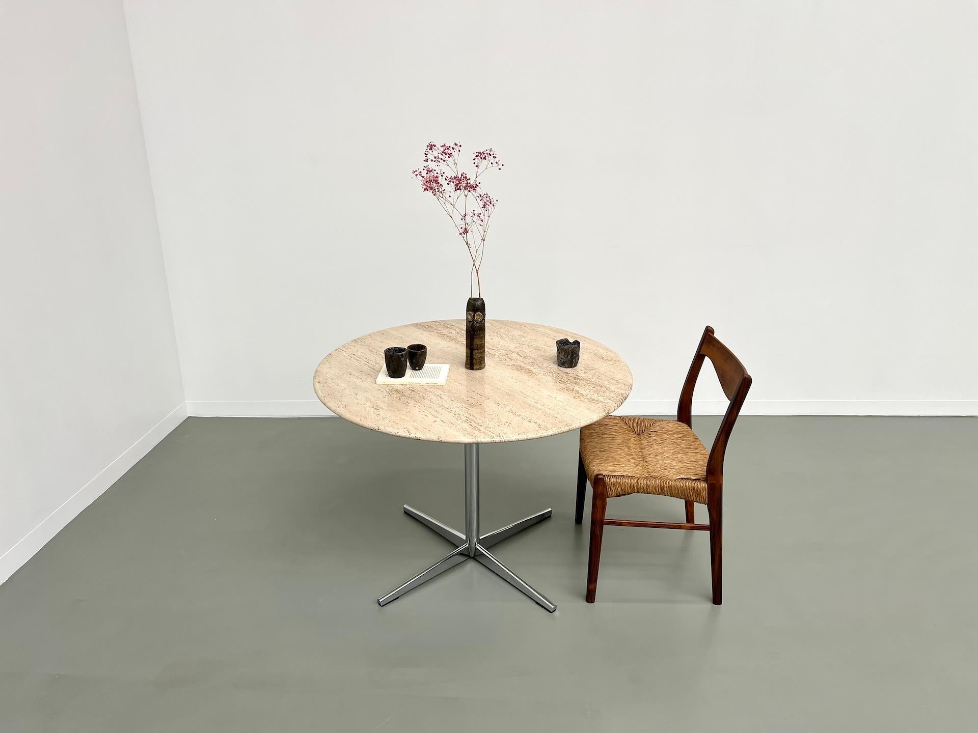Mid-Century Modern Round travertine dining table, circa 1970.