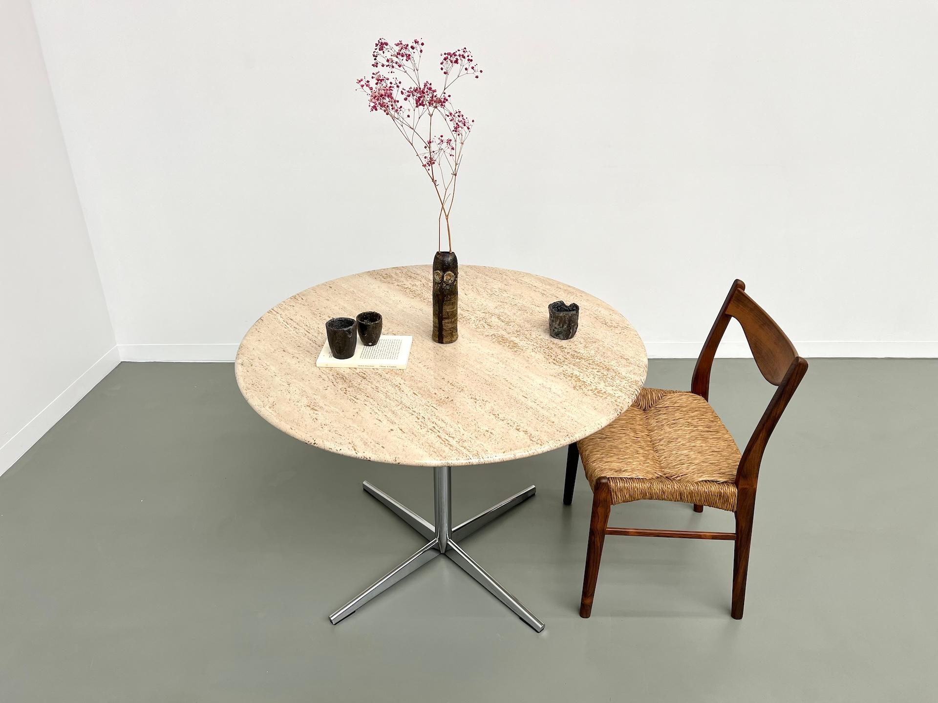 French Round travertine dining table, circa 1970.