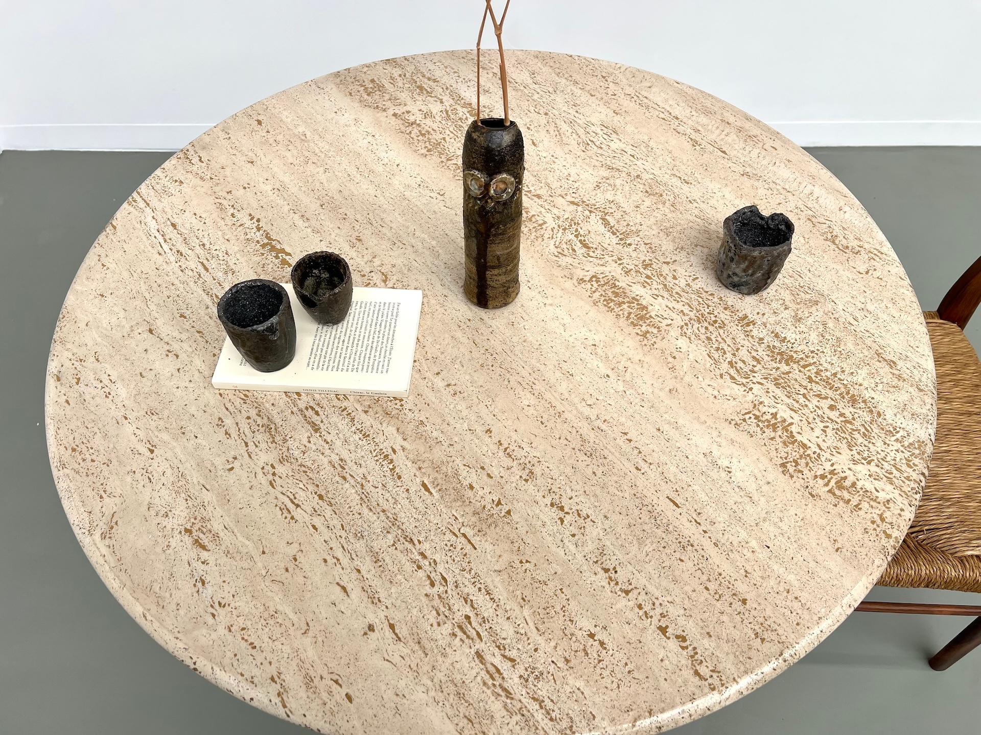 Late 20th Century Round travertine dining table, circa 1970.