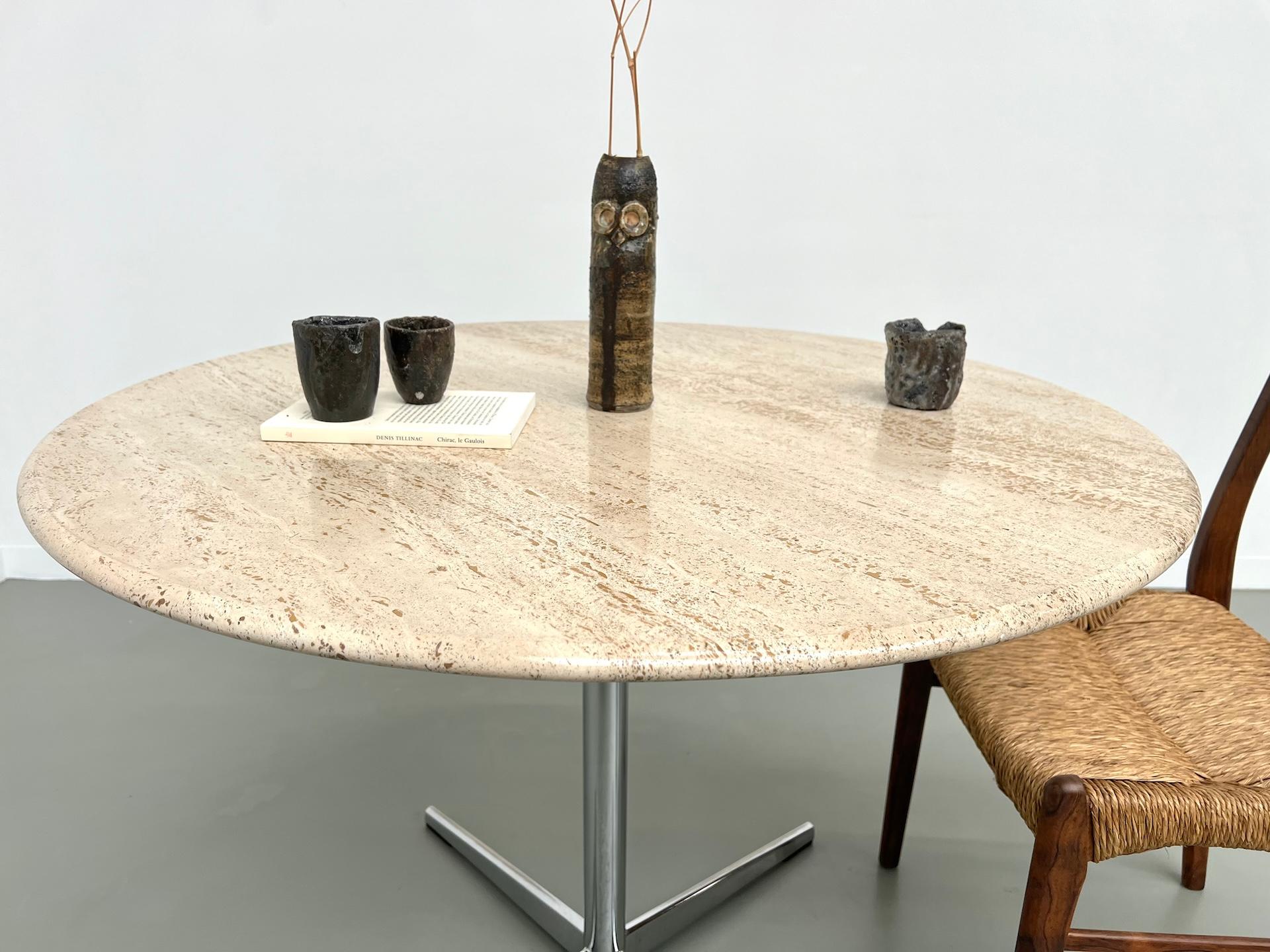 Travertine Round travertine dining table, circa 1970.