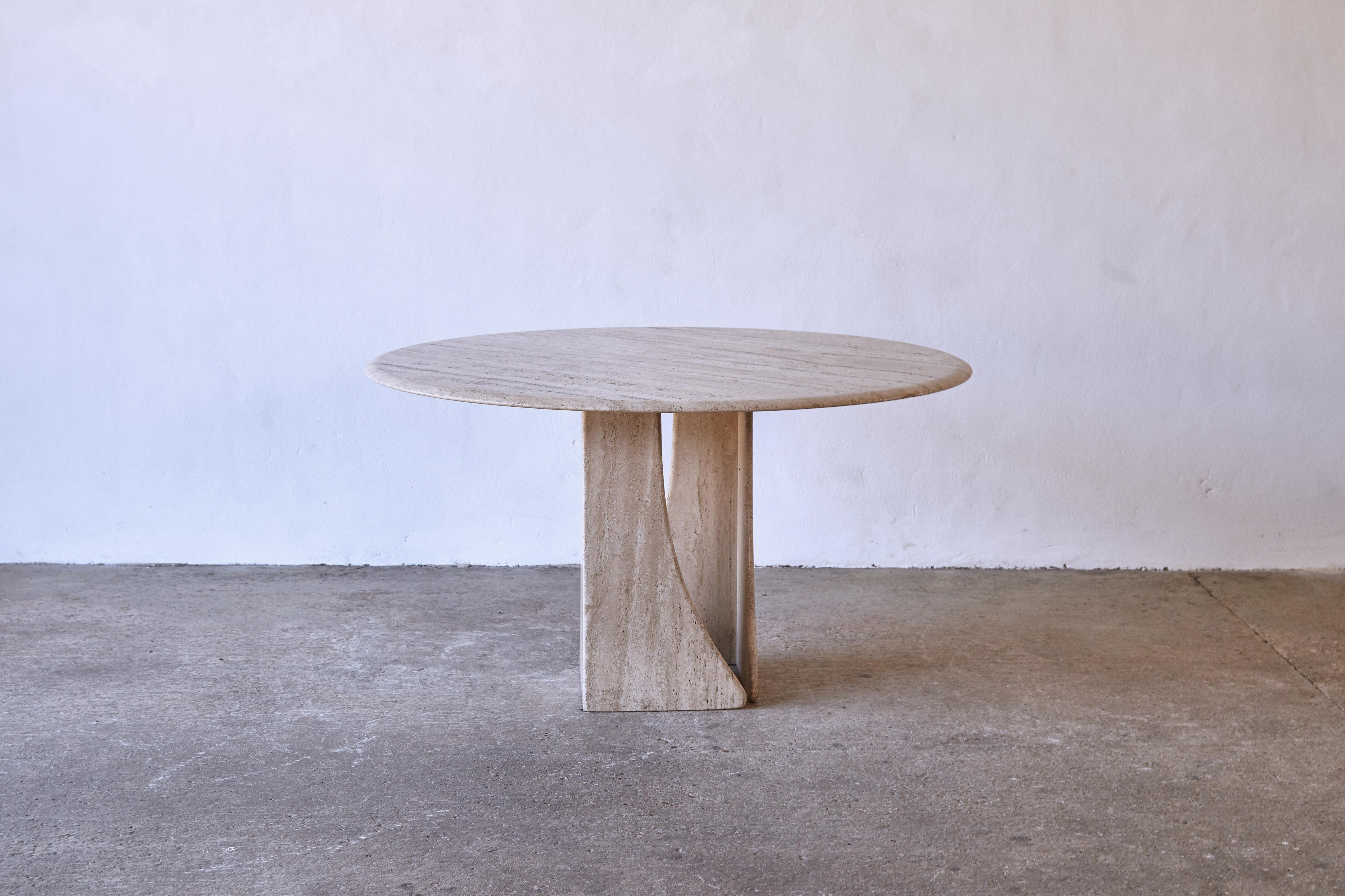 A round travertine dining table, France/Italy, 1970s. The travertine has a wonderful tone and texture. A round tabletop resting on two curved legs. Good original condition. 





Please note: Prices do not include VAT. VAT may be applied depending
