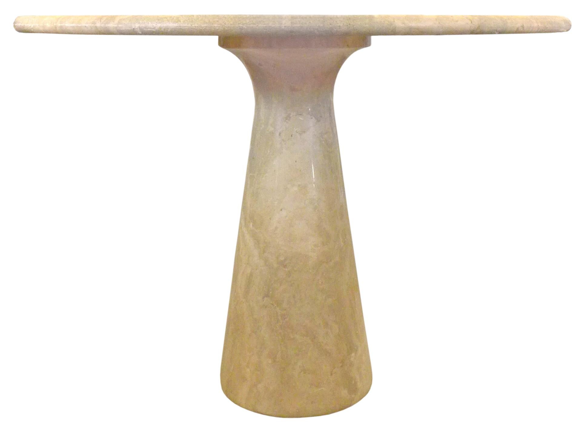 A fantastic round, travertine, pedestal-base dining table in the manner of Angelo Mangiarotti. Classic stucco-and-polished stone with a pleasant oatmeal hue and beautiful striation, veining throughout. Impressive scale, design and material, a