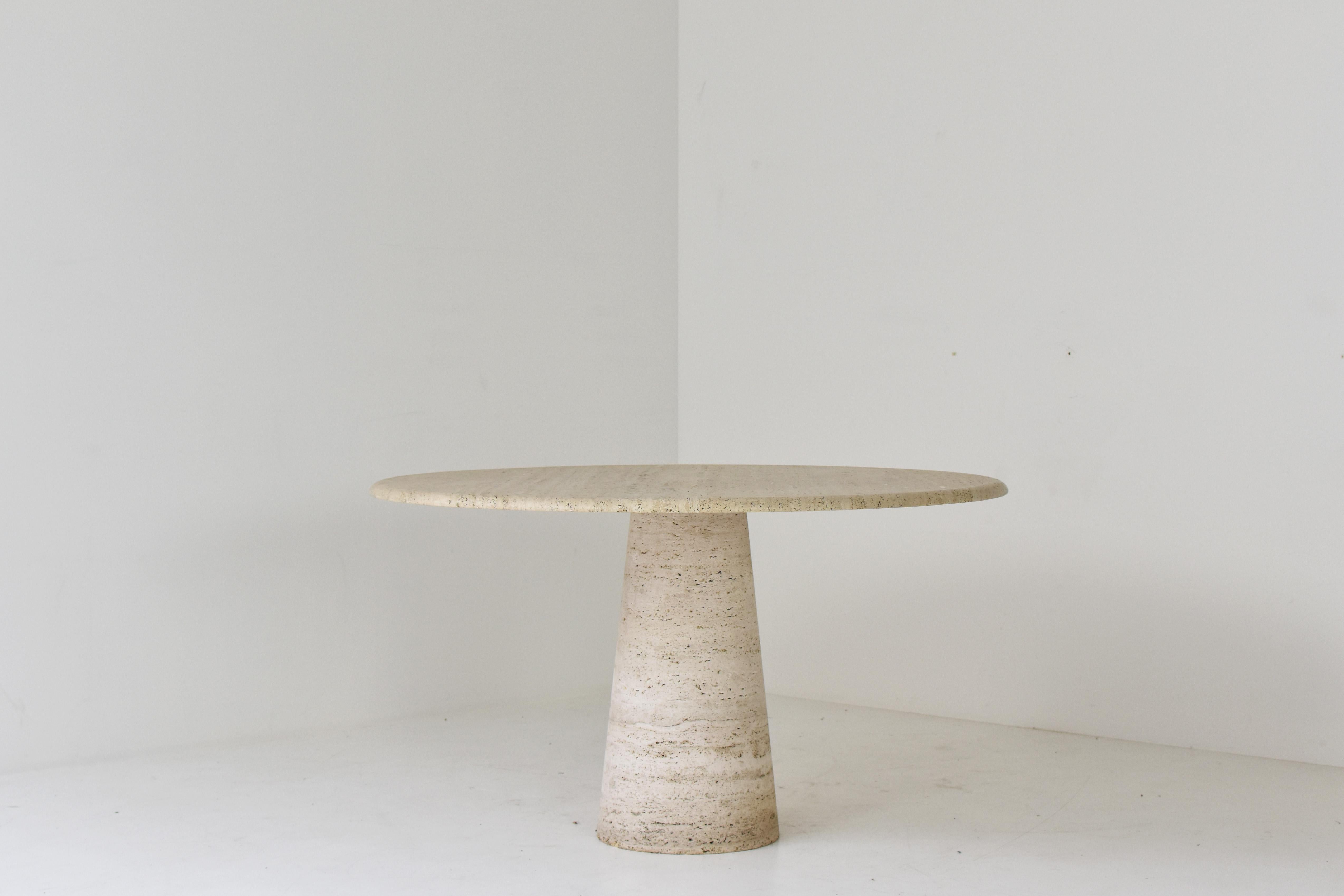 Mid-Century Modern Round travertine dining table in the manner of Angelo Mangiarotti, Italy 1970’s