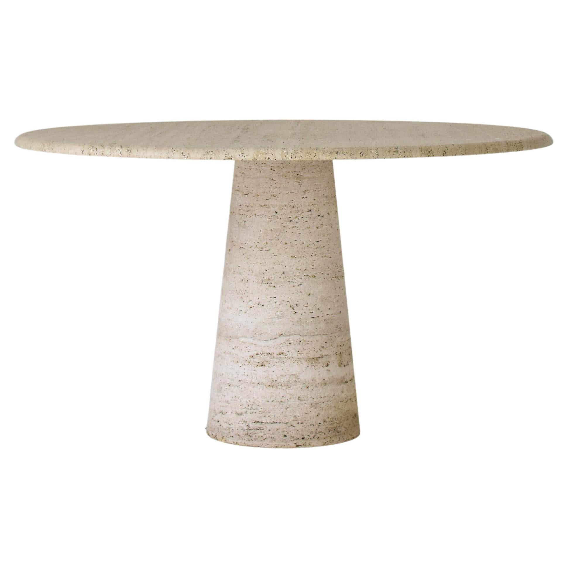 Round travertine dining table in the manner of Angelo Mangiarotti, Italy 1970’s