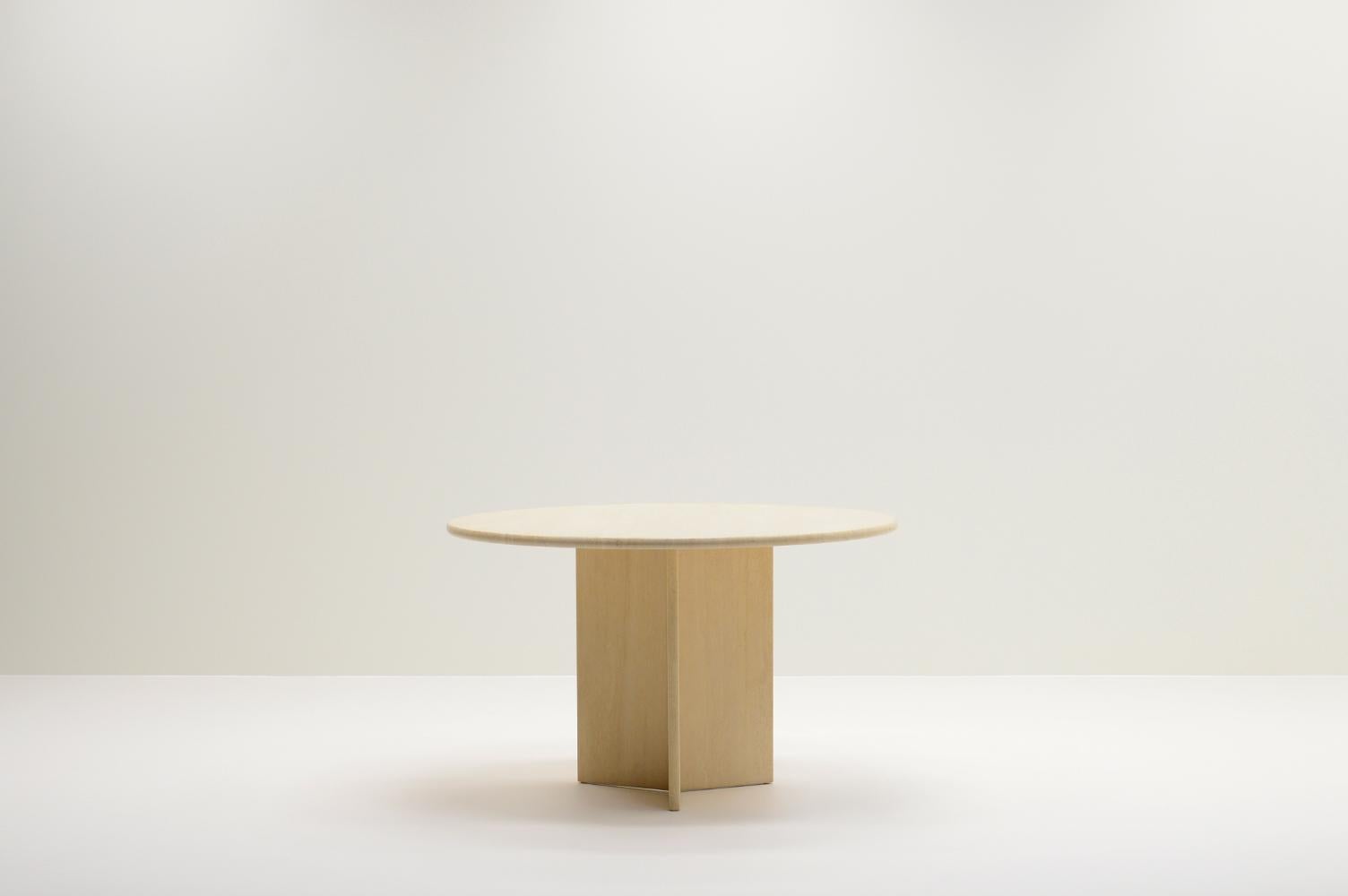 Round travertine dining table made in Italy, 1970s. Solid travertine top and base. The top has a rounded edge and the base is made of three slabs of travertine. The table has a satin finish. In very good vintage condition. 

Request a quote for the