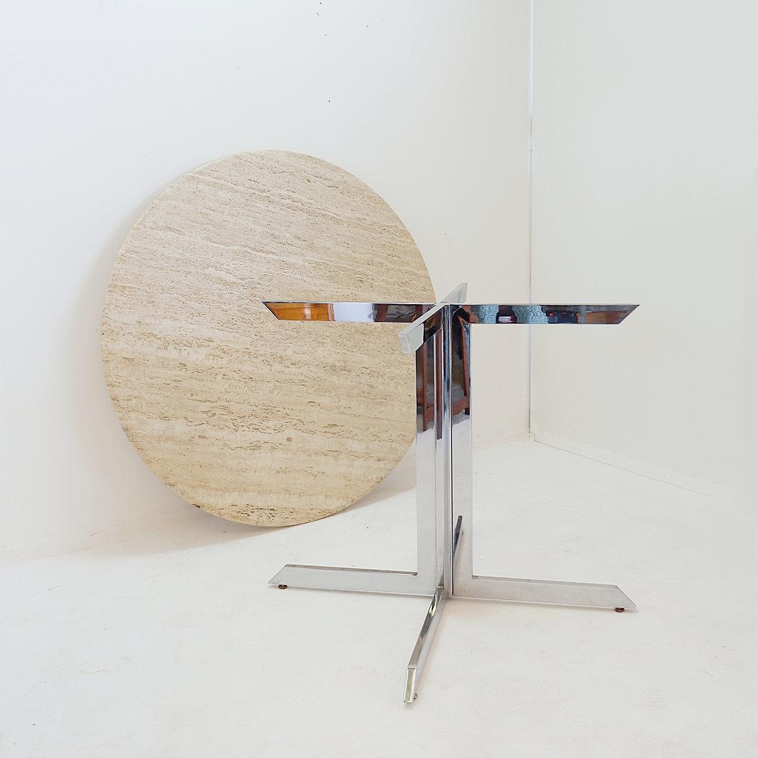 Round travertine dining table with chrome base, 1970s - Ø120cm
Florence Knoll Style - Roche Bobois spirit
Measures : Ø 120cm H:78,5cm 
Materials : Travertine - Chrome 
Weigth : ~140kg
Wear consistent with age and use