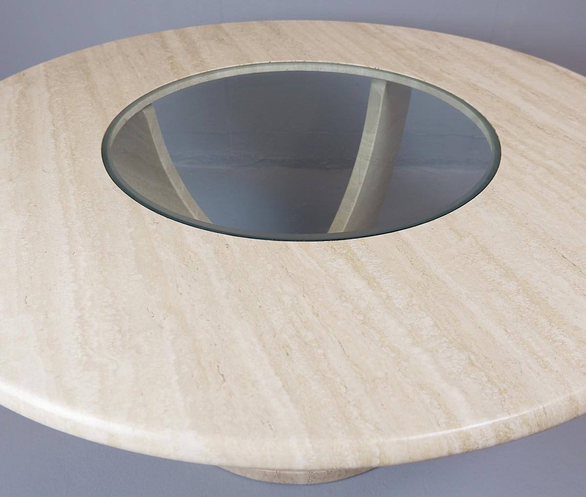 Round travertine and glass coffee table.