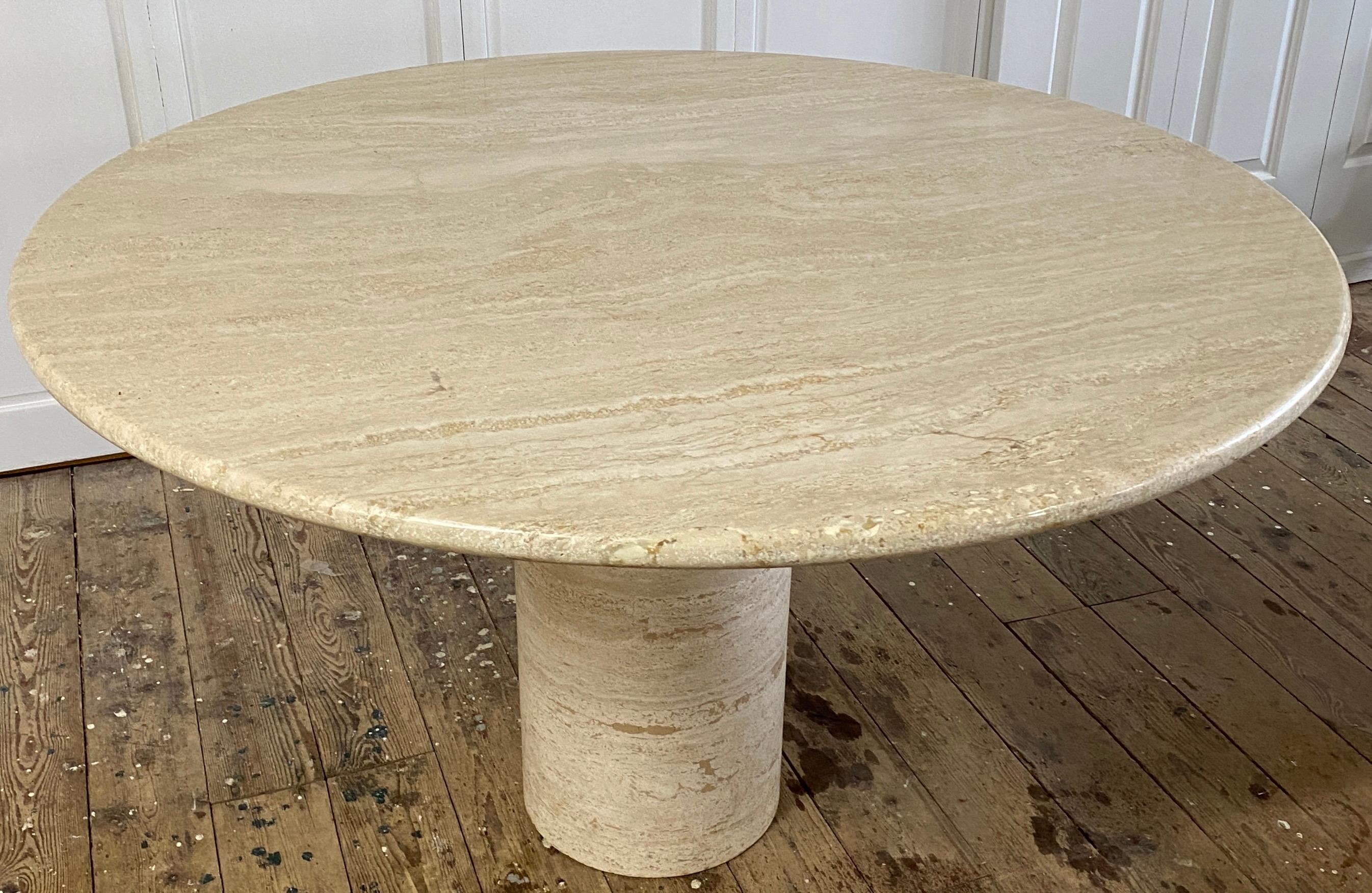 Beautifully carved from a single large slab, this round streamlined travertine top is set on top of a slender circular pedestal base giving it elegance and simplicity to work in the most modern or antique setting. The top and base have been sealed