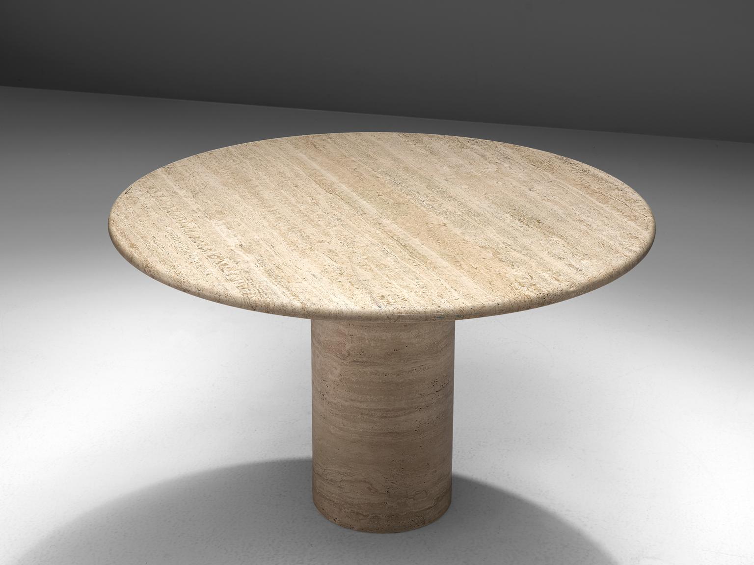 Centre table, travertine, Europe, 1970s.

This strong dining table features a massive, round foot and a thick circular travertine tabletop. The aesthetics are archetypical for postmodern design, bearing references to architectural forms and