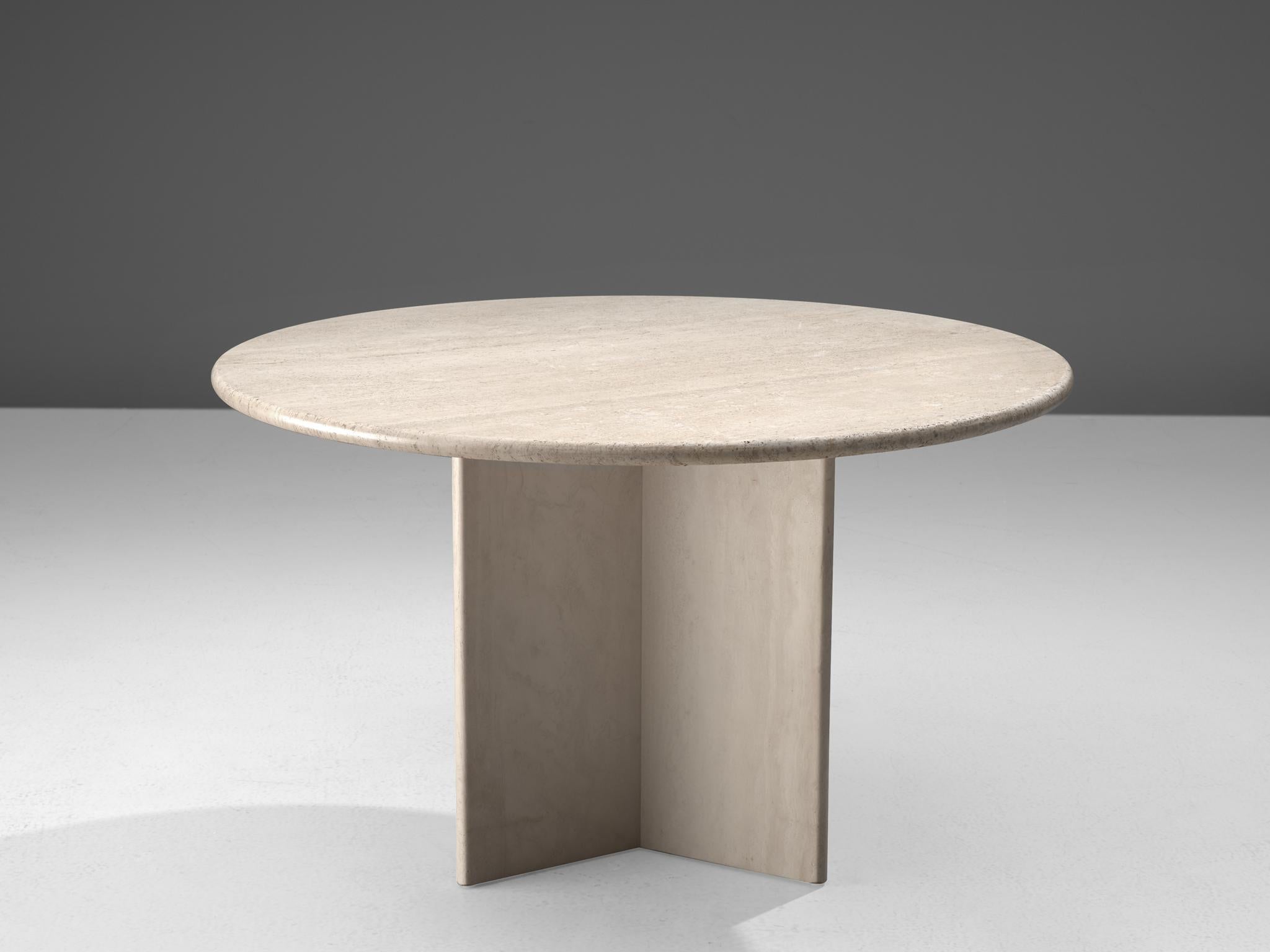 Centre table, travertine, Europe, 1970s.

This strong design dining table features a massive, triangular shaped foot and a thick circular travertine table top. The aesthetics are archetypical for postmodern design, bearing references to