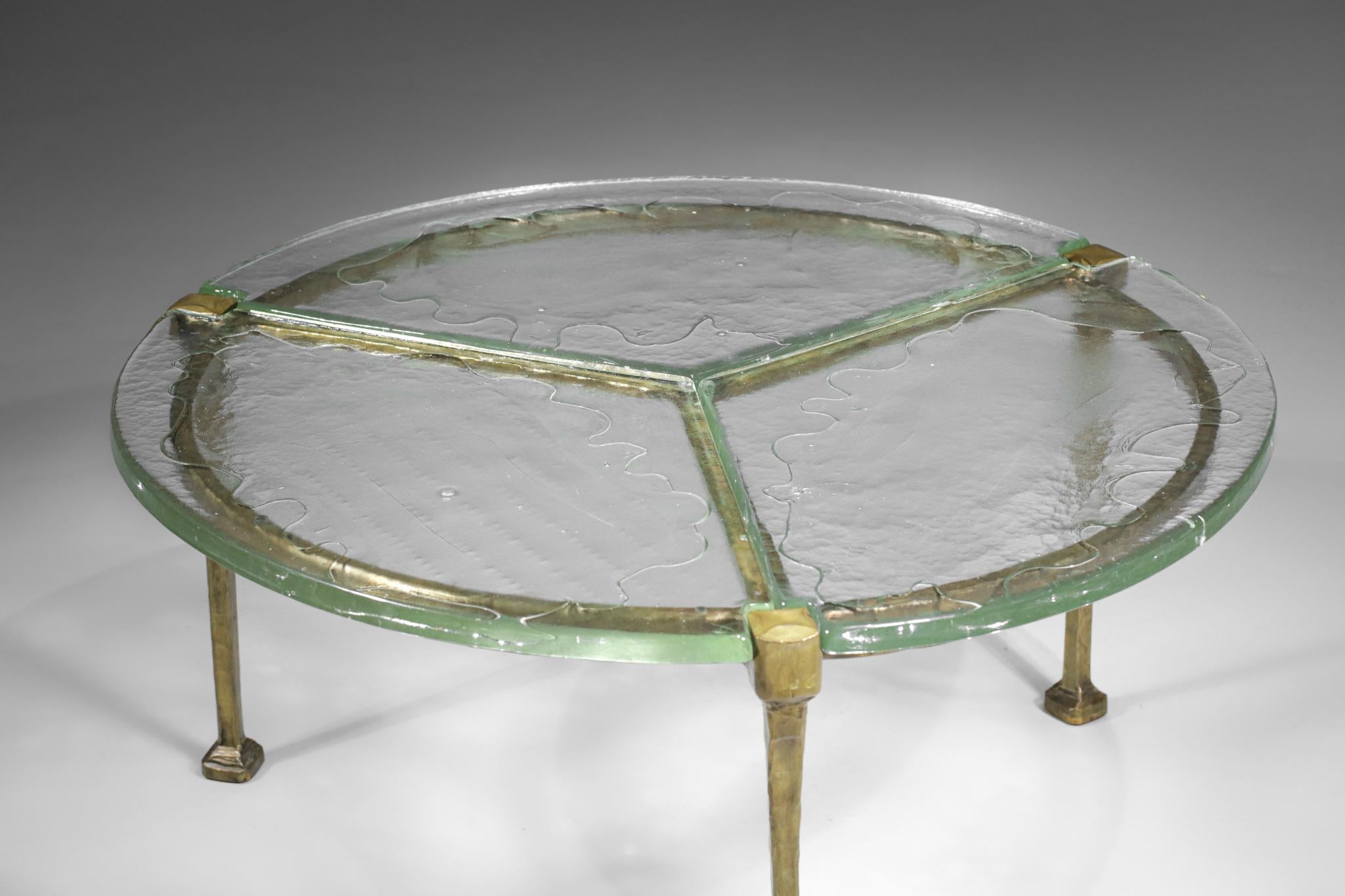 Tripod bronze coffee table by the German artist Lothar Klute. Solid bronze structure and top made of three thick glasses (2,5 cm). Excellent vintage condition, note a small chip on one of the edges (see photos).