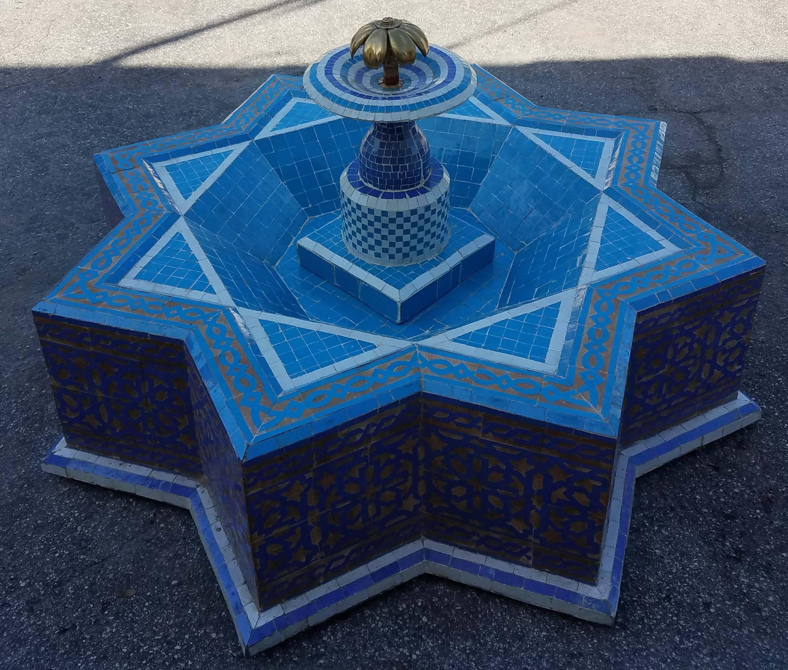 This is a typical Moroccan Mosaic fountain handmade in Marrakech. This fountain is usually found in courtyards and Riads all-over Morocco. It measures approximately 50 inches diameter and 22 inches height and weighs about 325 lbs.
 