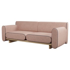 Round two-seater sofa Tilda with Nude plain fabric handcrafted by Murmurio