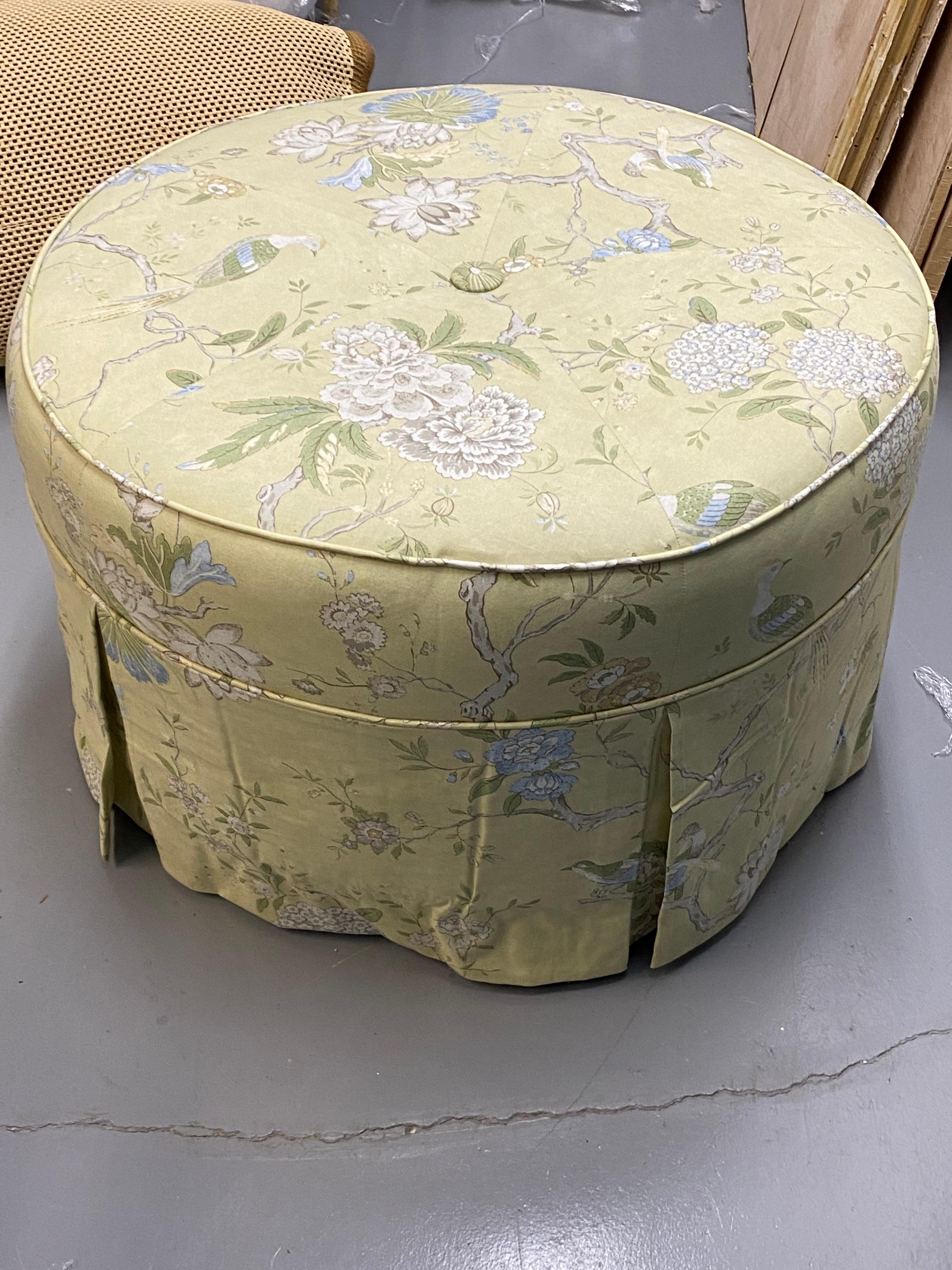 Round Upholstered Pouf Ottoman in Yellow Chinoiserie Cotton Fabric
Upholstered in a bright greeny-yellow cotton chinoiserie fabric. A single center button, and kick pleated skirt.
Upholstery in good overall condition, with light fading, skirt