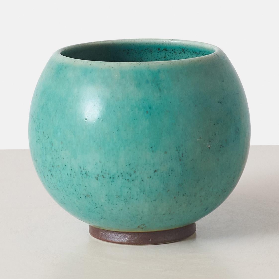 A footed aquamarine hares fur glaze vase by Eva Stæhr Nielsen for Saxbo. Stamped with the Saxbo yin-yang symbol, model number 11, and “SAXBO DANMARK”. The yin-yang symbol was used in the period from 1937-1949 and together with “Danmark” in the