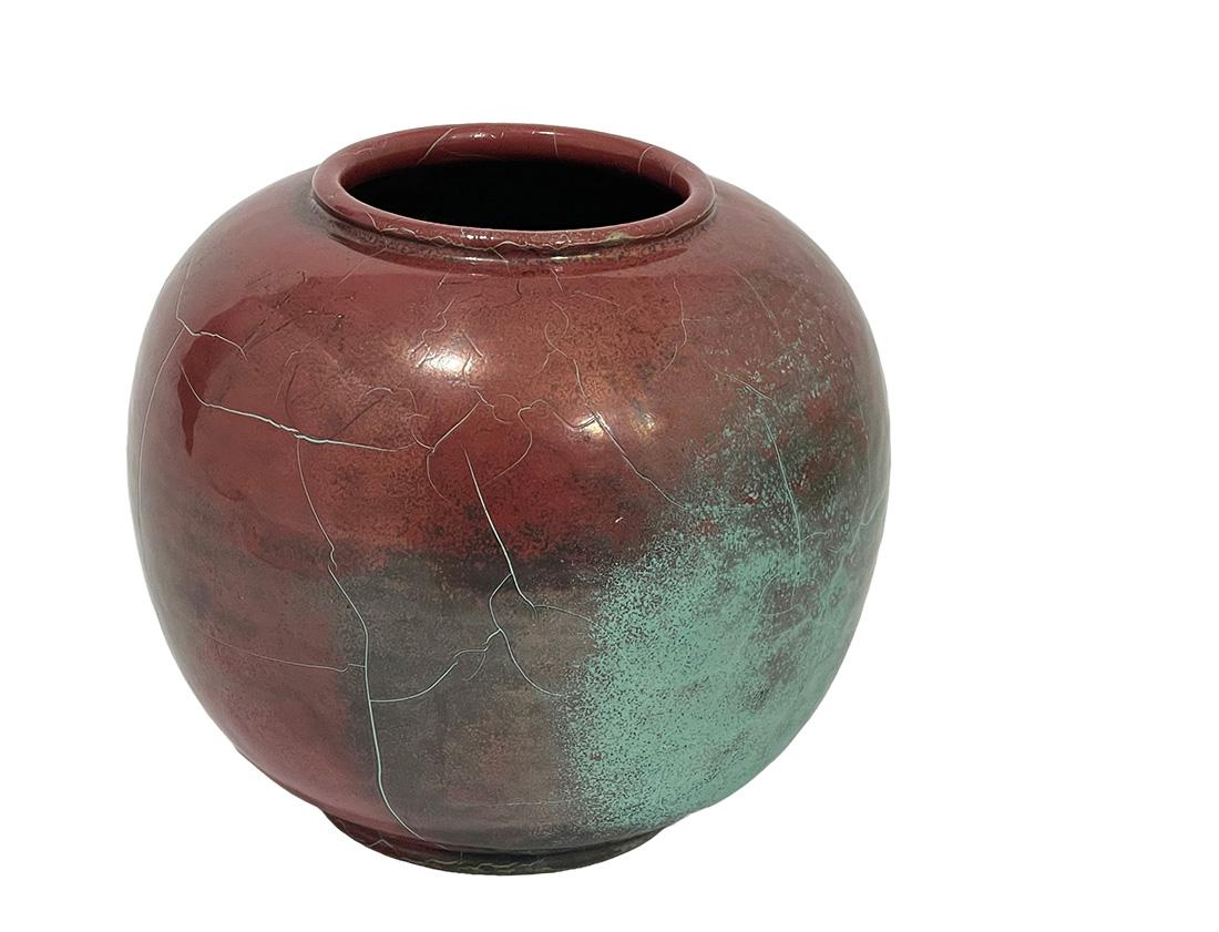 Round vase by Richard Uhlemeyer, Germany 1940s

Round shape and a turquoise and brown-red colored ceramic vase in a crackle style
RICHARD UHLEMEYER (1900-1954) was born in Göttingen, Germany, and attended the arts and crafts school in Hannover in