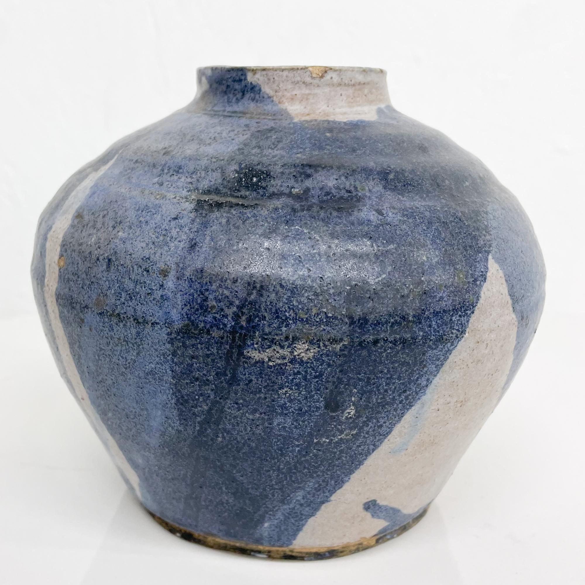 For your consideration: Vase in swirling shades of blue ceramic Art Pottery Mid-Century Modern
Wide mouth fat base
Stamped underneath. Unable to read name. Small hole at bottom as pictured.
Measures: 6.75 in diameter x 7.5 tall inches
Preowned