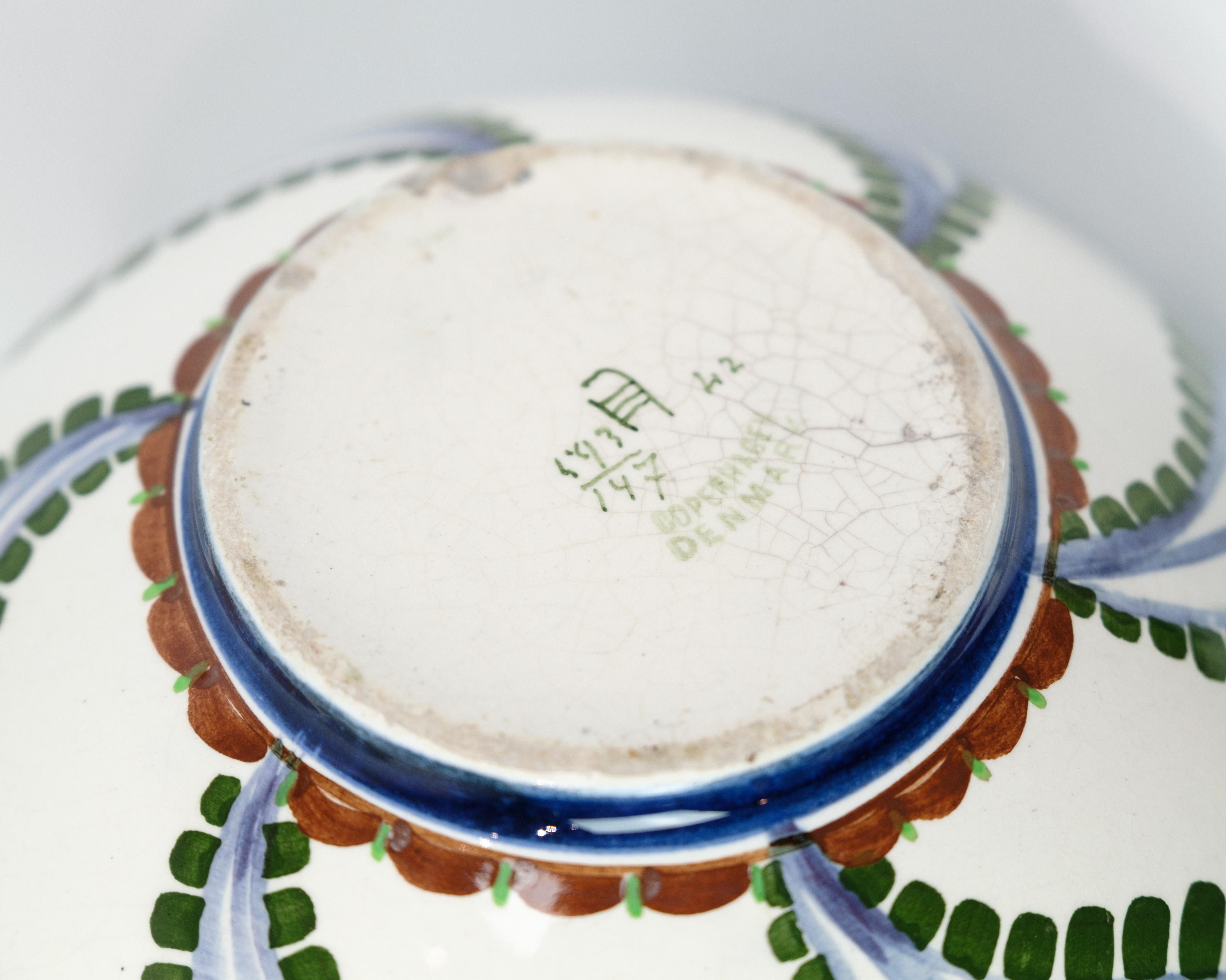 Round Vase with floral motif of art faience made by Harald Slott-Møller Model 593/147. The vase is in excellent condition without any chips.
Dimensions: H:24 cm Dia:22 cm