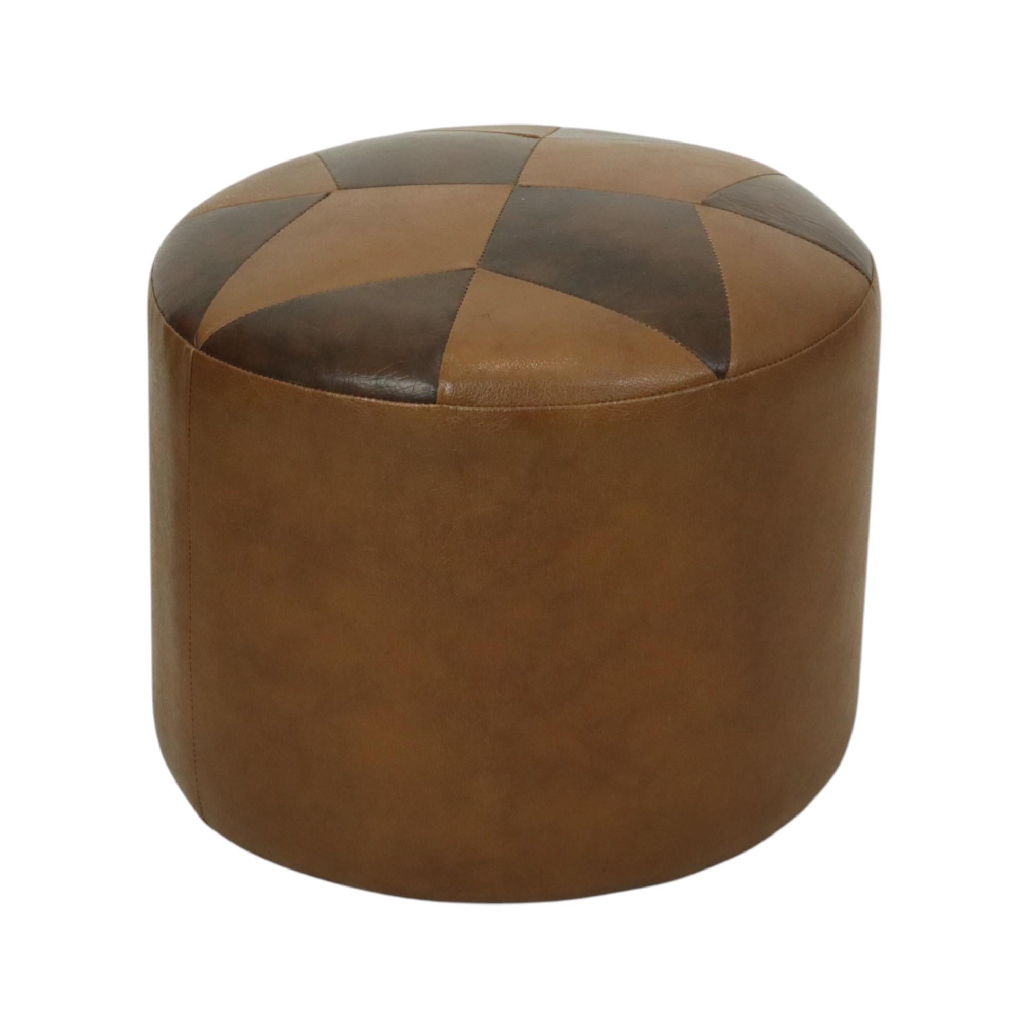 Cool vintage round patchwork-style ottoman, made from a wooden base and upholstered in high-quality two-tone brown faux leather with a star motif at the top, made in Belgium circa the 1960s.

A characterful and authentic object from the 1960s, this