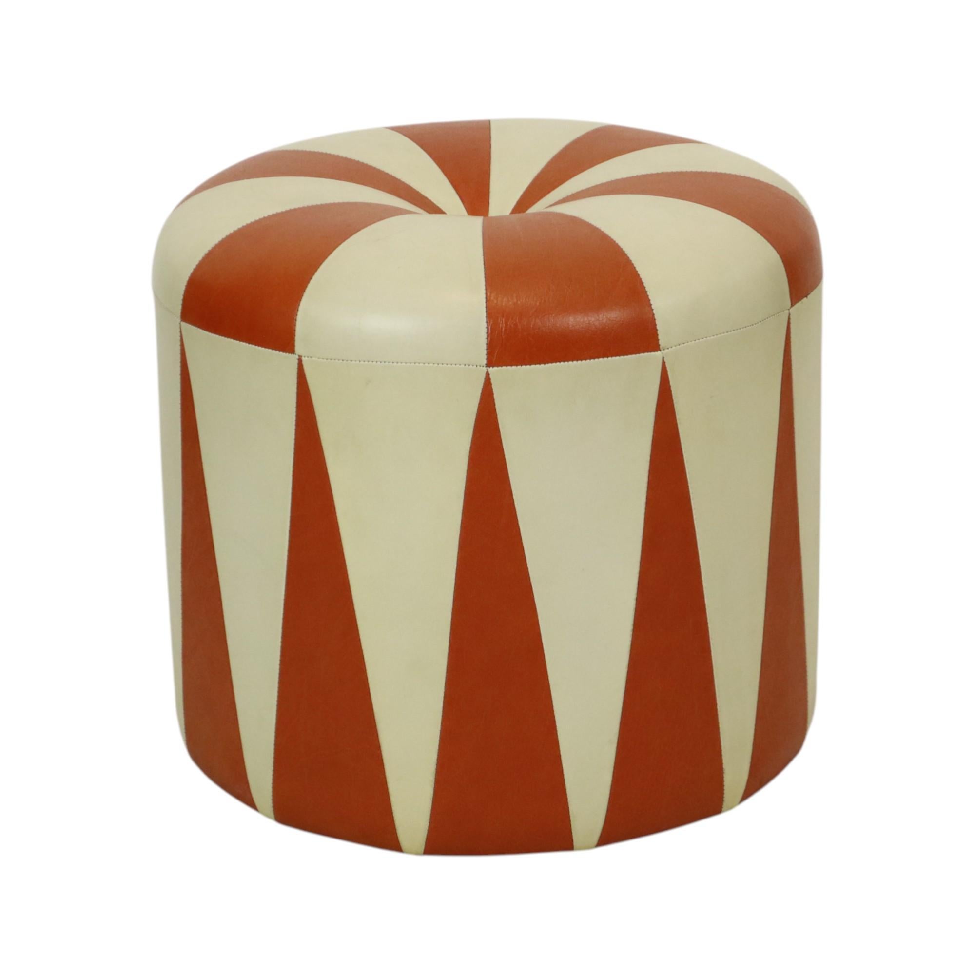Cool vintage round ottoman in Moroccan patchwork style, made from a wooden base and upholstered in high-quality two-tone orange-brown and cream faux leather, made in Belgium circa the 1960s.

A characterful and authentic object from the 1960s, this