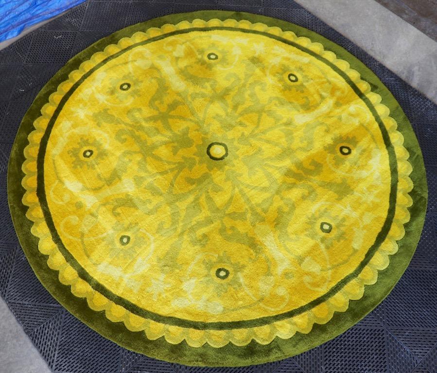 Wonderful decorative round rug by Stanislav V'Soske. Center flower with radiating foliate and organic border. Wool, hand tufted, newly professionally cleaned, and treated, clean plush and ready to use. This carpet shows no damage or wear, it is even