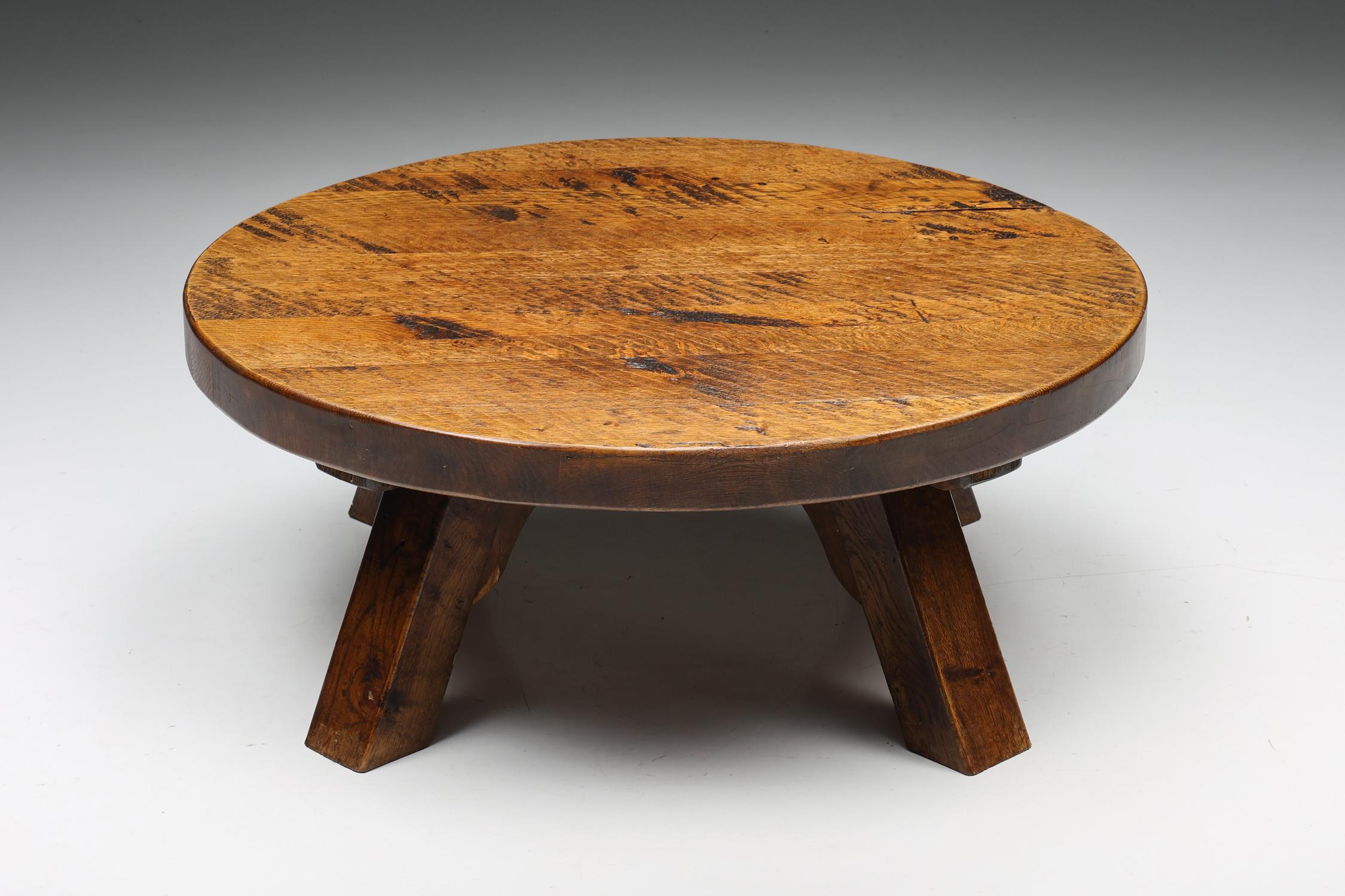 Round Wabi-Sabi rustic coffee table, France, Craftsmanship, 1950's

Rustic round coffee table with a four-legged base. The rounded top makes space for objects like magazines and other curiosities. Can also be used as a side table. This table has