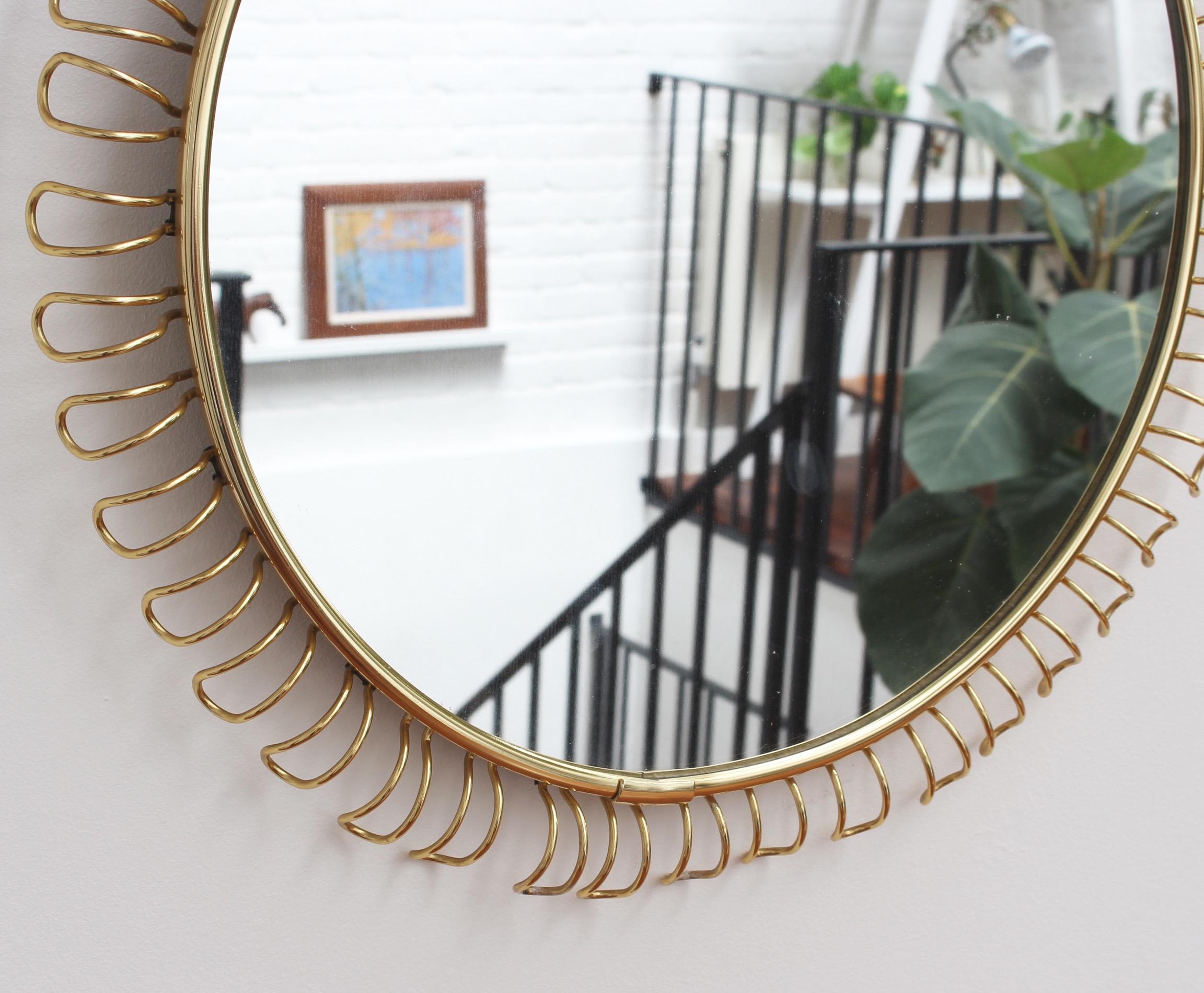 Swedish Round Wall Mirror in Brass with Decorative Surround by Josef Frank